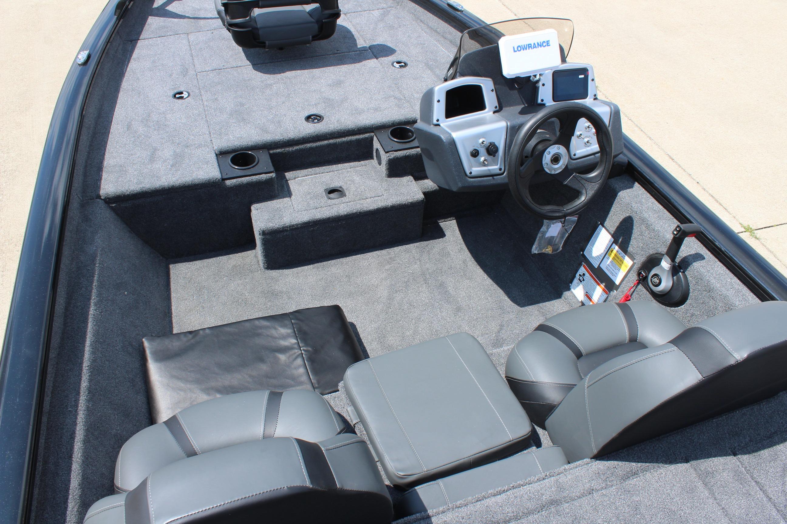 2026 Tracker Pro Team 175 boat interior with steering console and seating.
