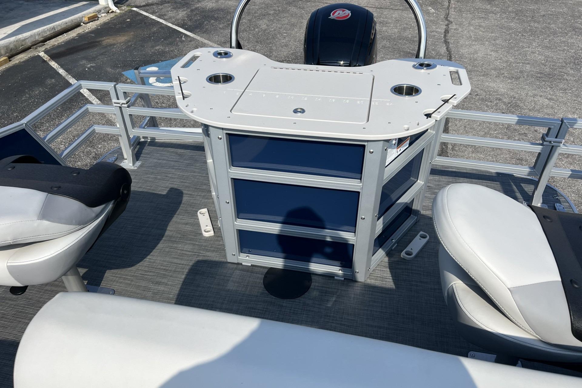2024 Lowe SF 214 Sport Fish boat interior with seating and control panel.