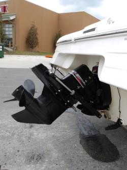 2004 Mariah SK-10 boat with outboard motor, parked on pavement.