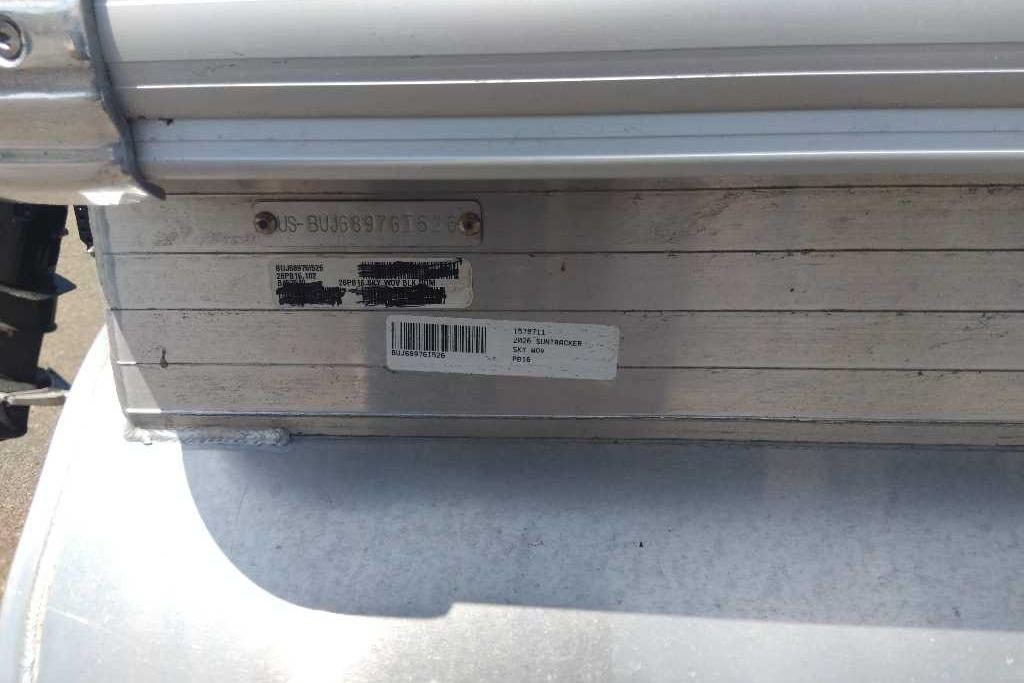 2026 Sun Tracker Party Barge 16 DLX identification plate on aluminum surface.