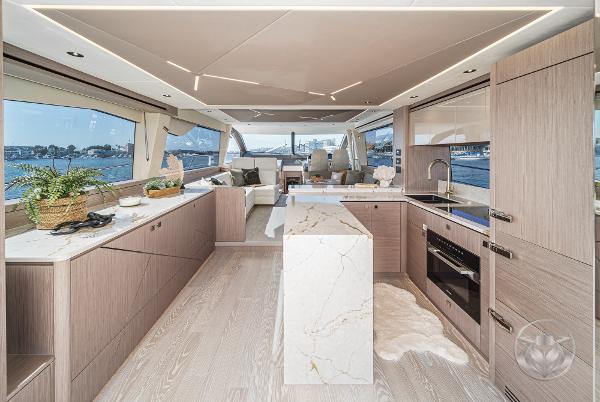 Luxurious interior of 2025 Sunseeker Manhattan 68 yacht with modern kitchen design.