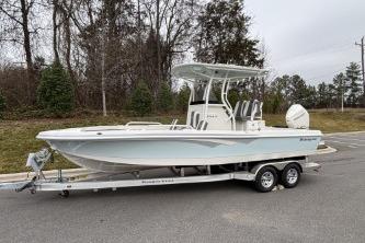 2025 Ranger 2360 Bay boat on trailer, parked outdoors.