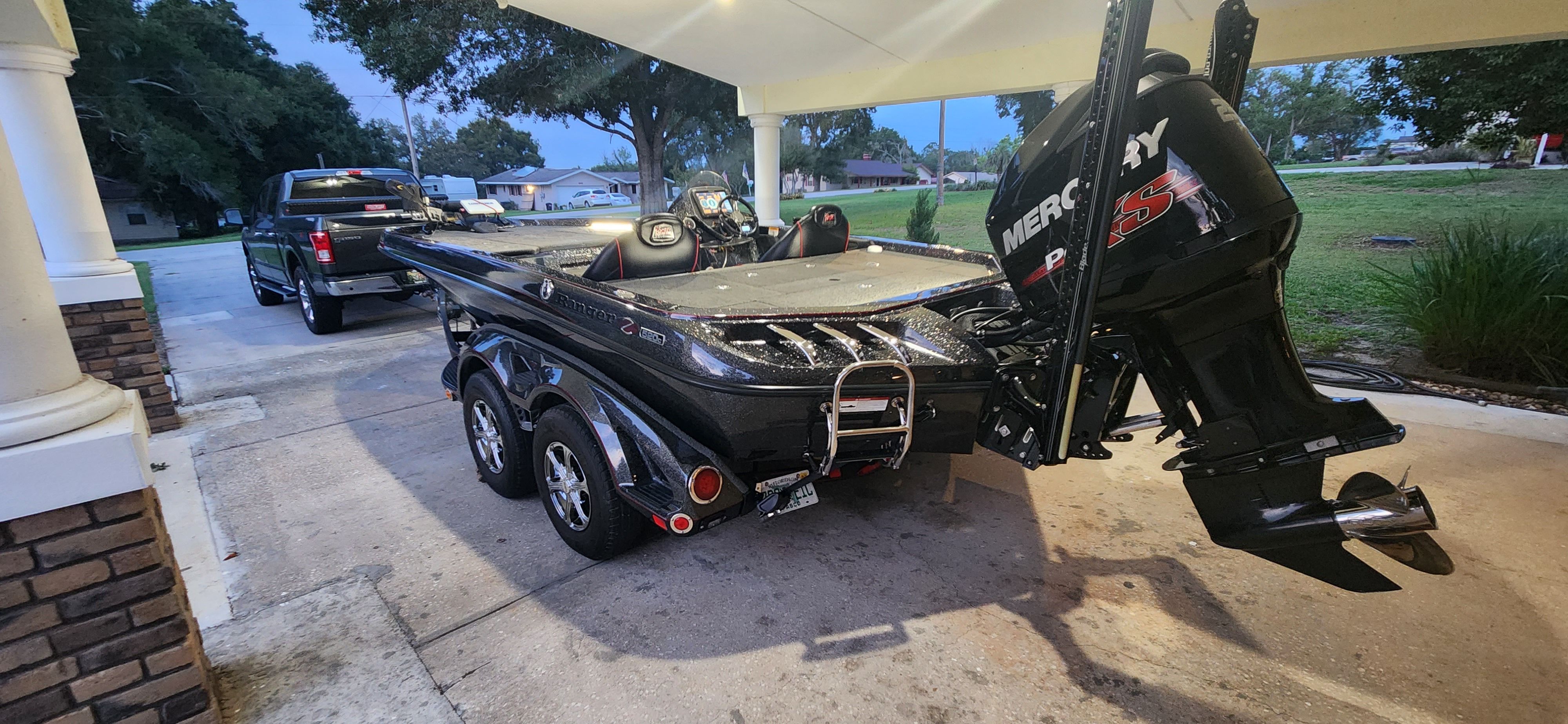 A 2017 Ranger Z520 Comanche on a trailer under a carport.