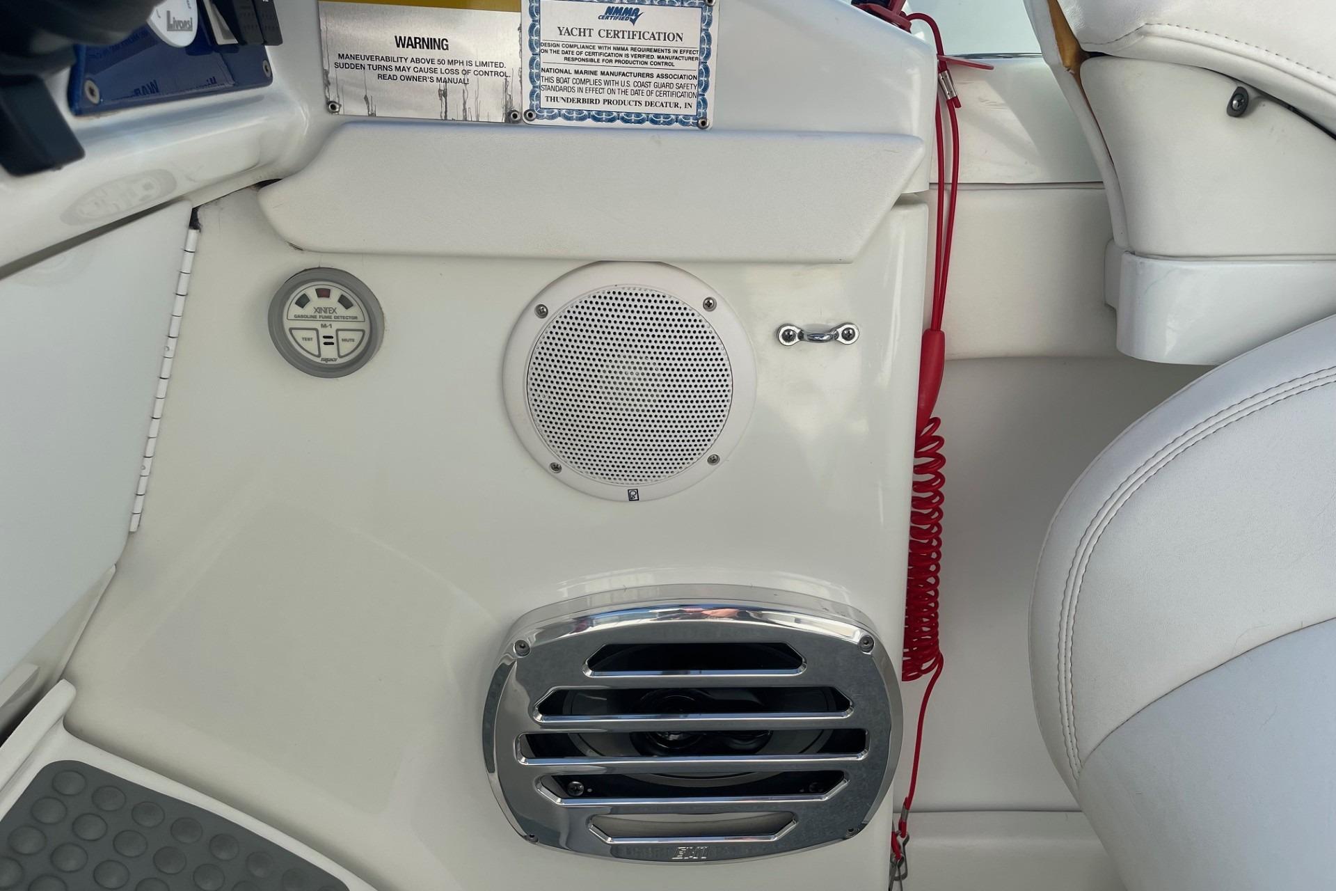 2004 Formula 382 FASTech boat interior with speaker, control panel, and red safety cord.