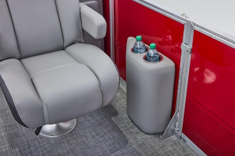 2026 Sun Tracker Party Barge 22 DLX interior with gray seat and cup holders.