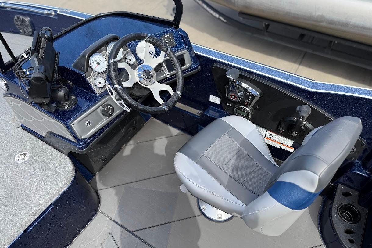 Interior of 2026 Nitro ZV21 Pro boat with steering wheel and control panel.