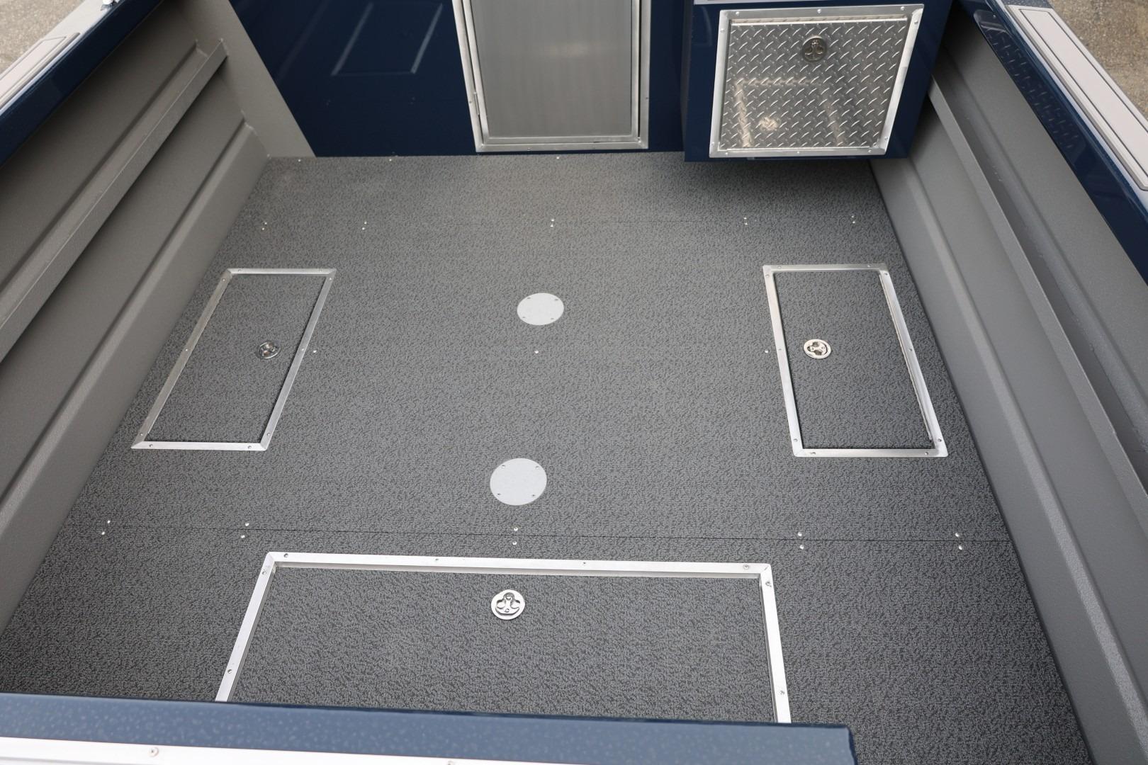 2026 Thunder Jet 24 Alexis Pro boat interior with storage compartments and non-slip flooring.