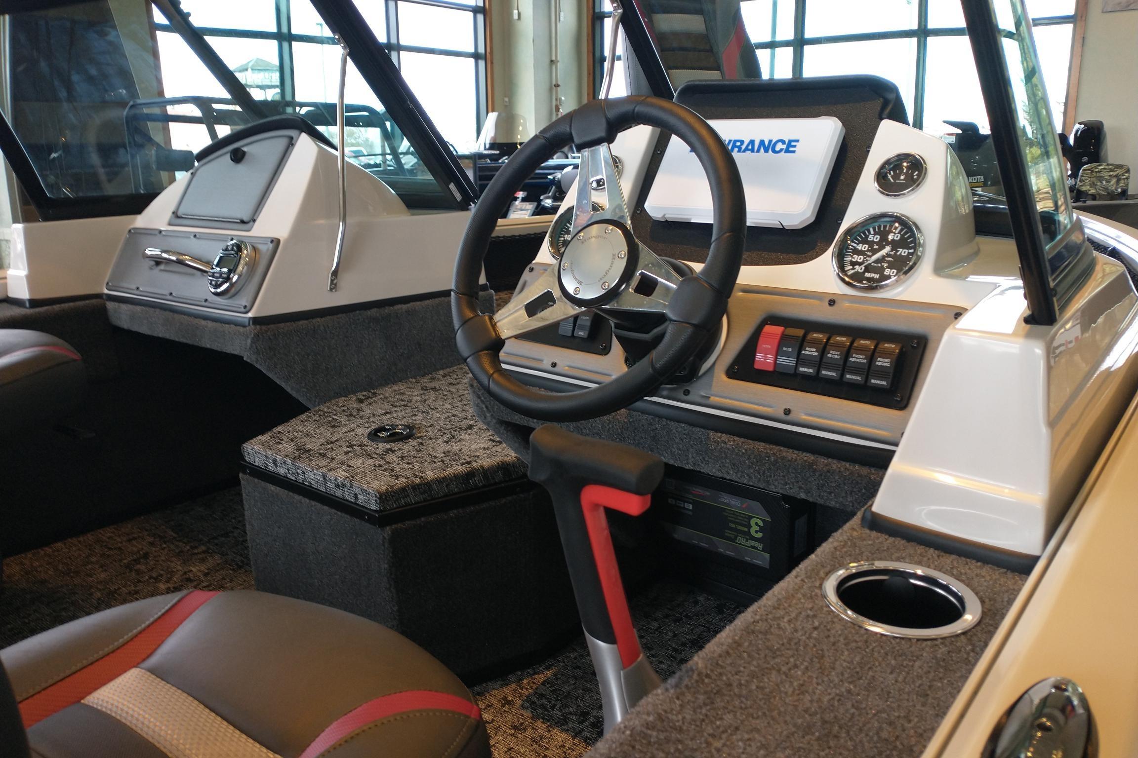 2026 Ranger VS1682SC Reata boat interior with steering wheel and control panel.