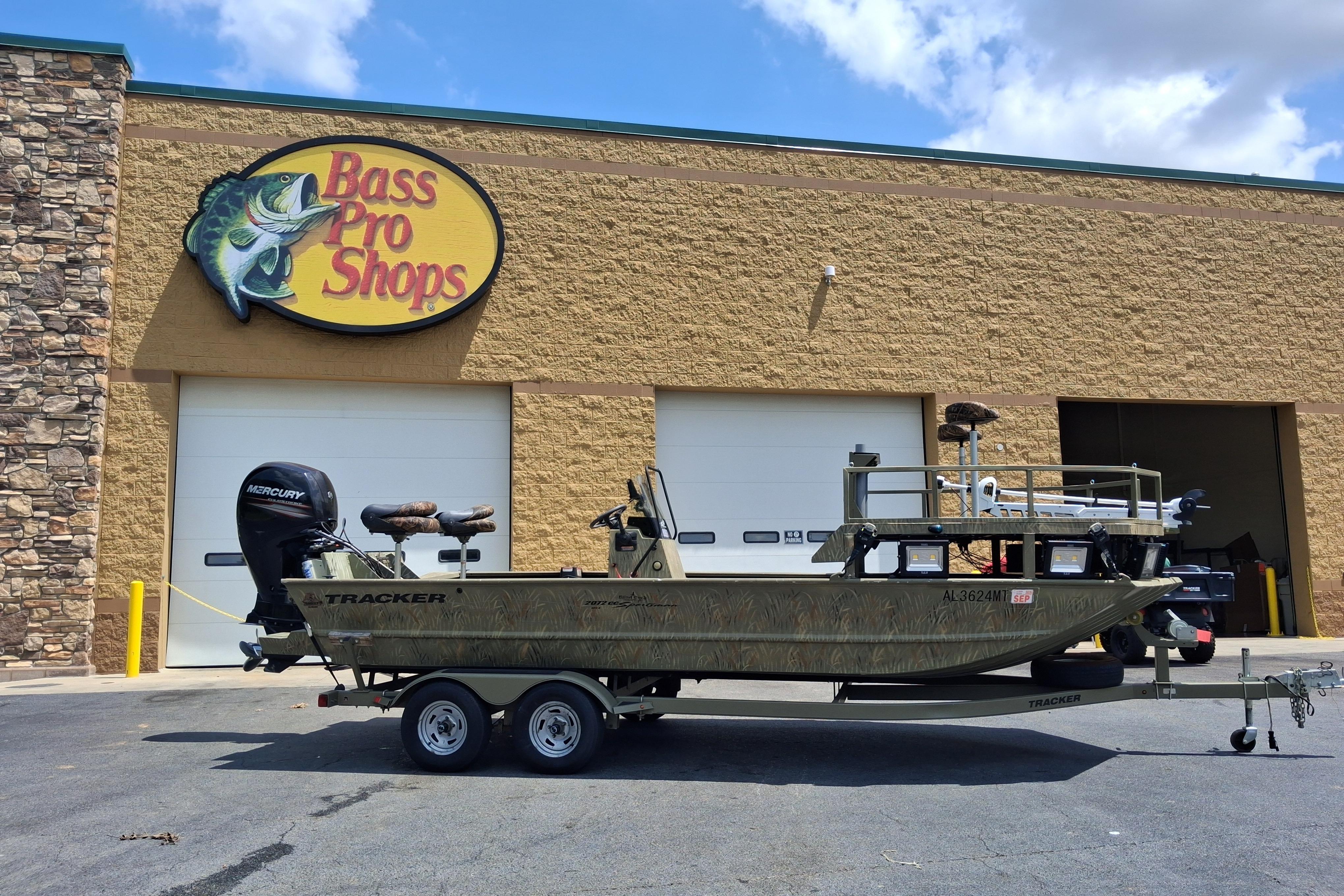 2016 Tracker Grizzly 2072 CC Sportsman boat outside Bass Pro Shops store.
