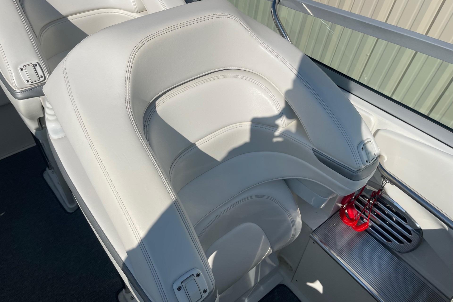 2004 Formula 382 FASTech boat interior with white leather seating and sleek design.