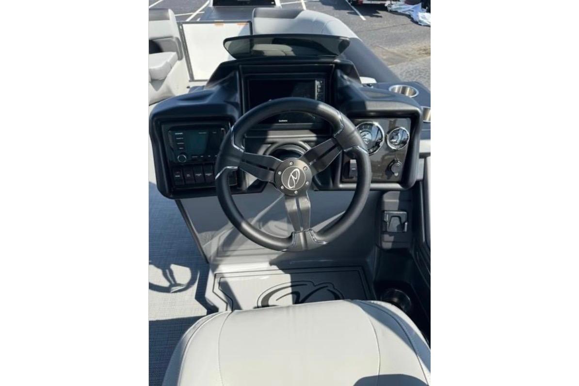 Steering console of 2025 Veranda Relax VR25VLC pontoon boat with modern controls.