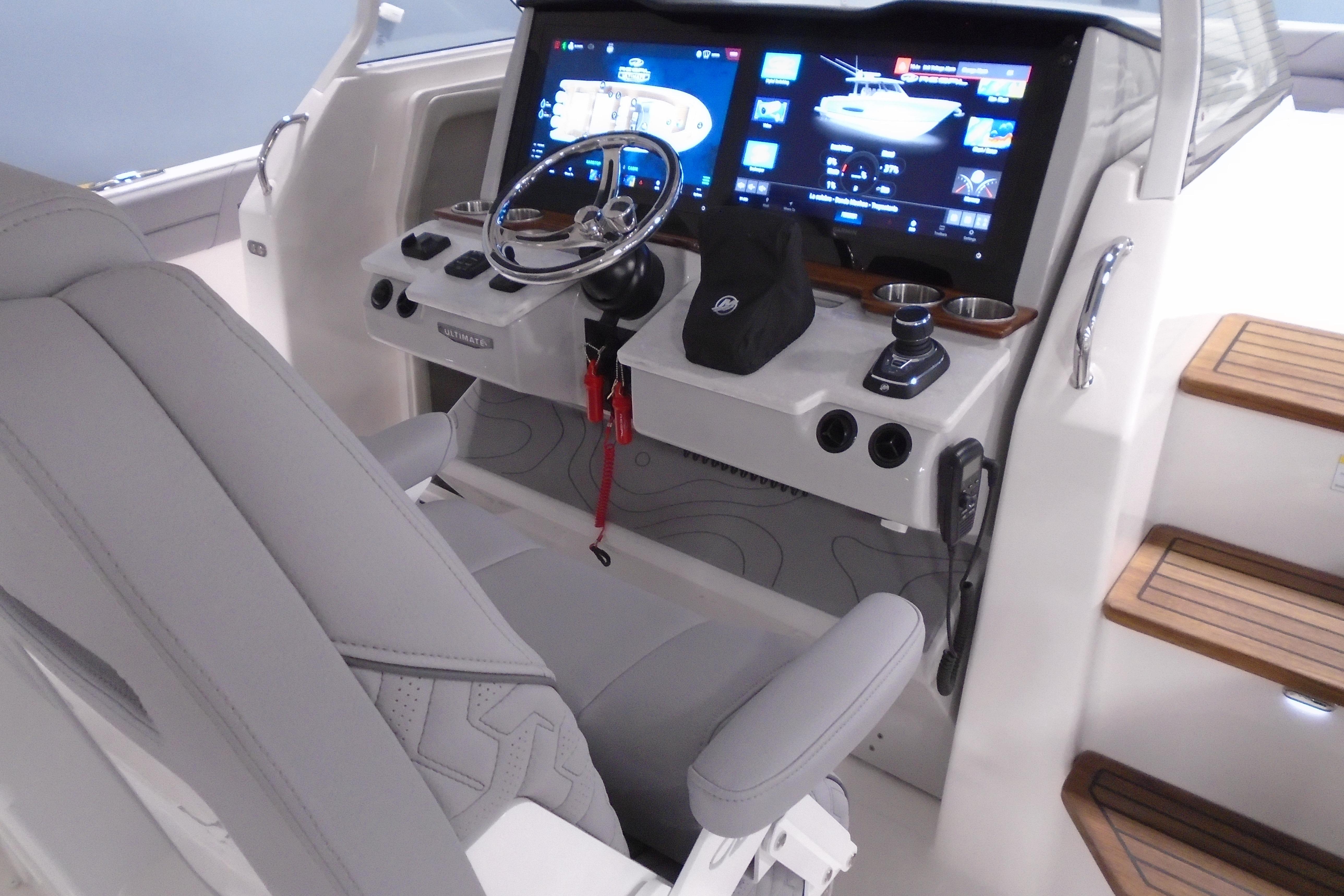 2026 Regal 38 SAV boat cockpit with modern controls and digital display.