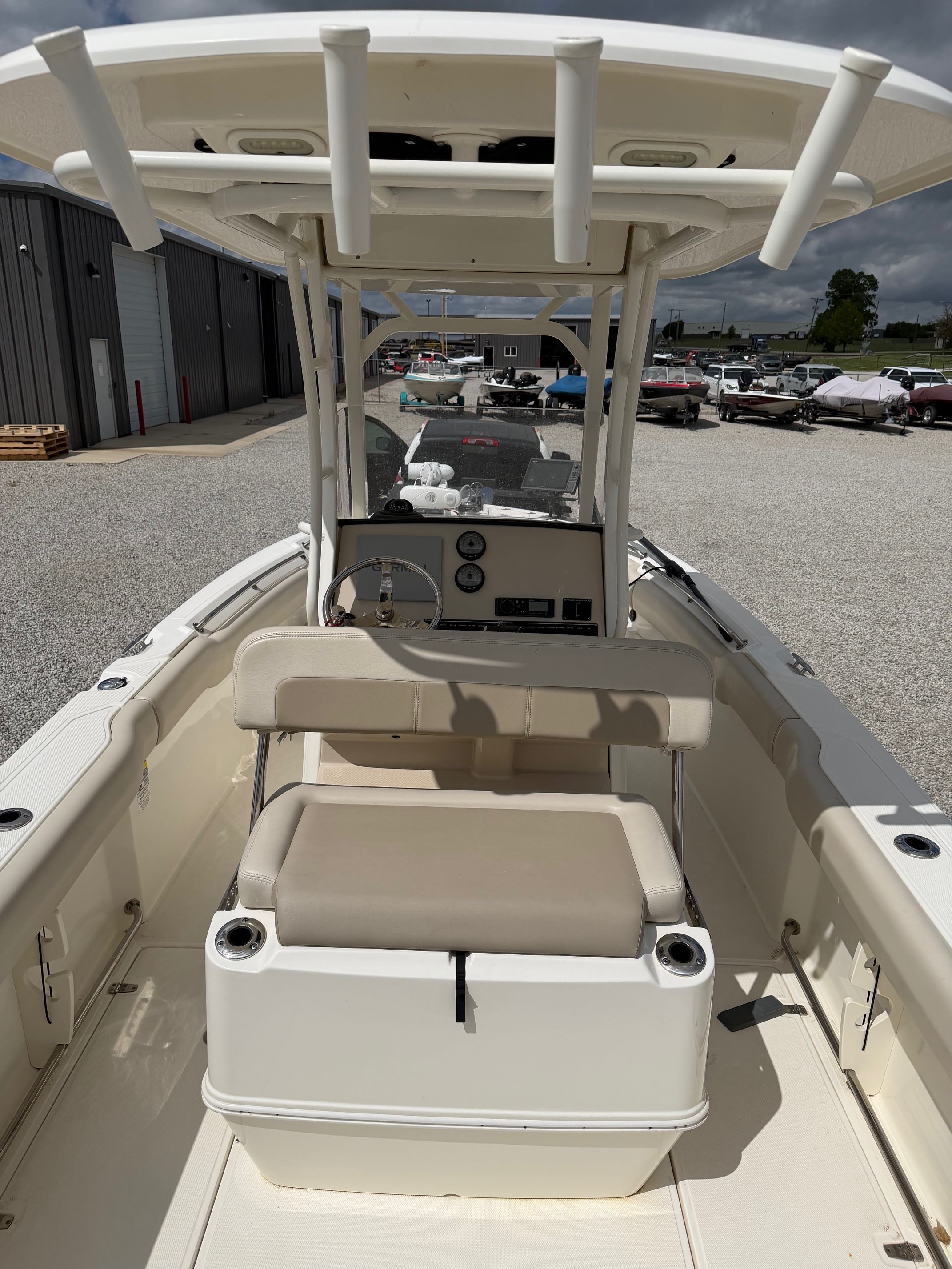 Boston Whaler 230 Outrage 2020 on a parking lot.