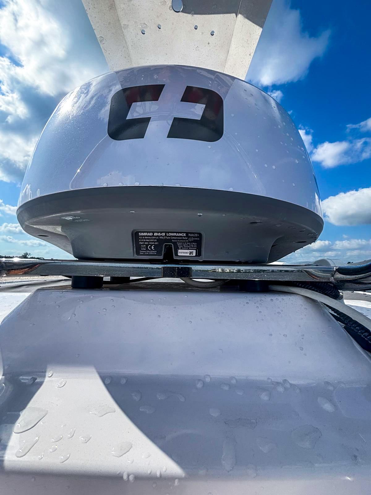 2022 Axopar 28 CABIN boat radar against a bright blue sky.