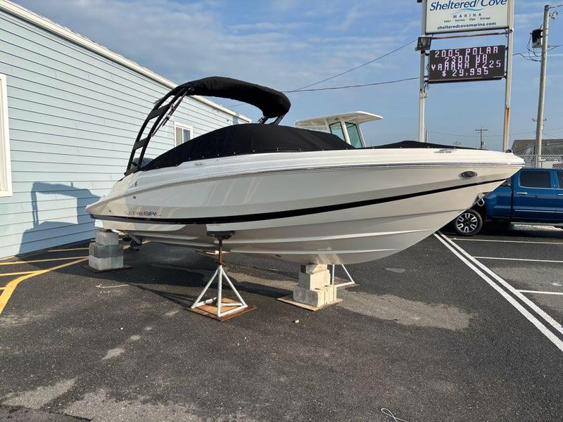 2026 Regal 21 OBX boat displayed at marina, elevated on stands.