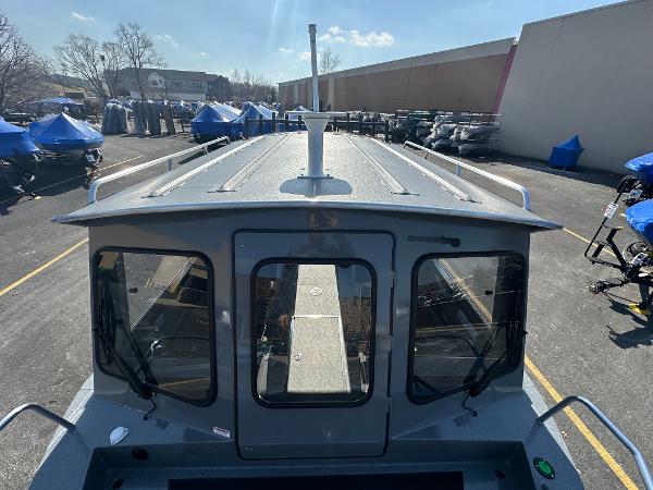 2024 Spartan 260 Maximus Pro XL boat in a parking lot.