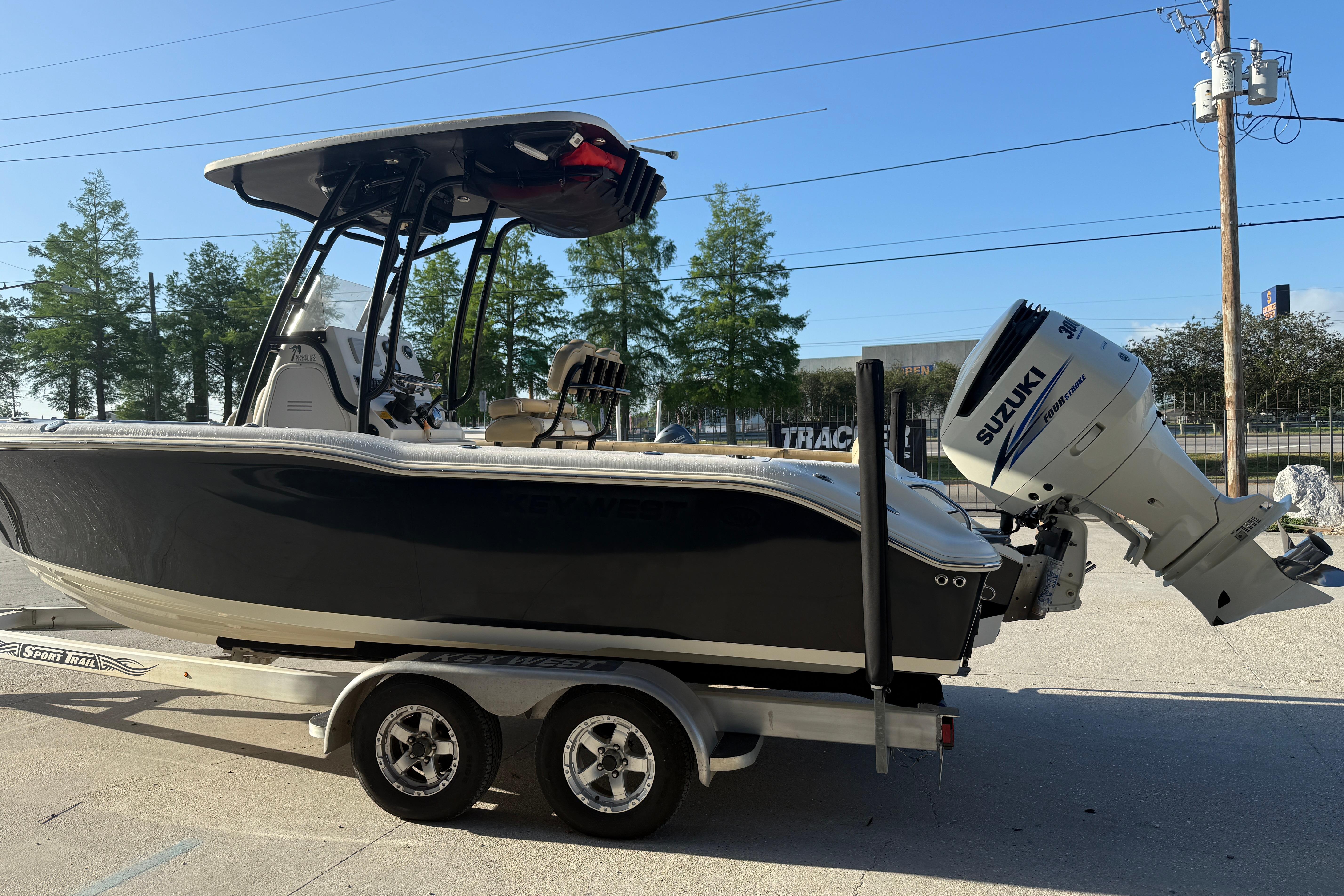 2016 Key West 239 FS boat on trailer with Suzuki outboard motor.