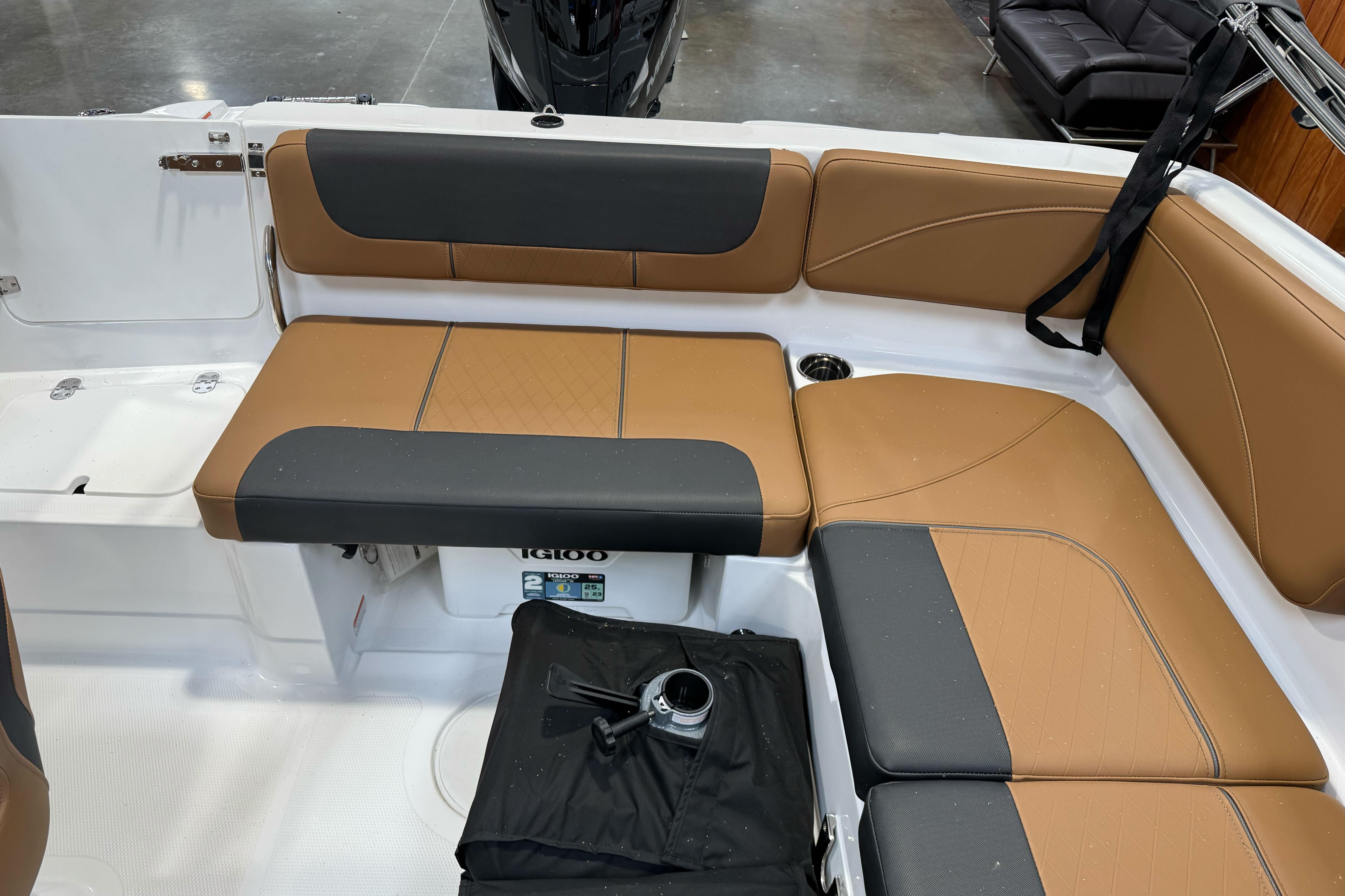 2026 Tahoe 2150 boat interior with tan and black seating, featuring a compact layout.
