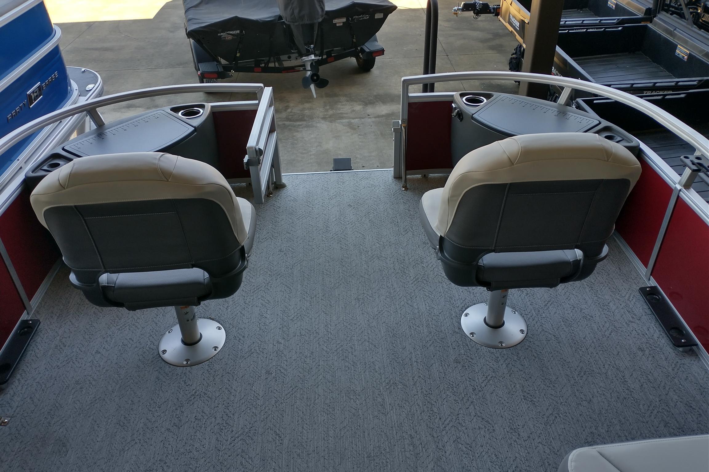 2026 Sun Tracker Bass Buggy 18 DLX pontoon boat with dual swivel seats and cup holders.