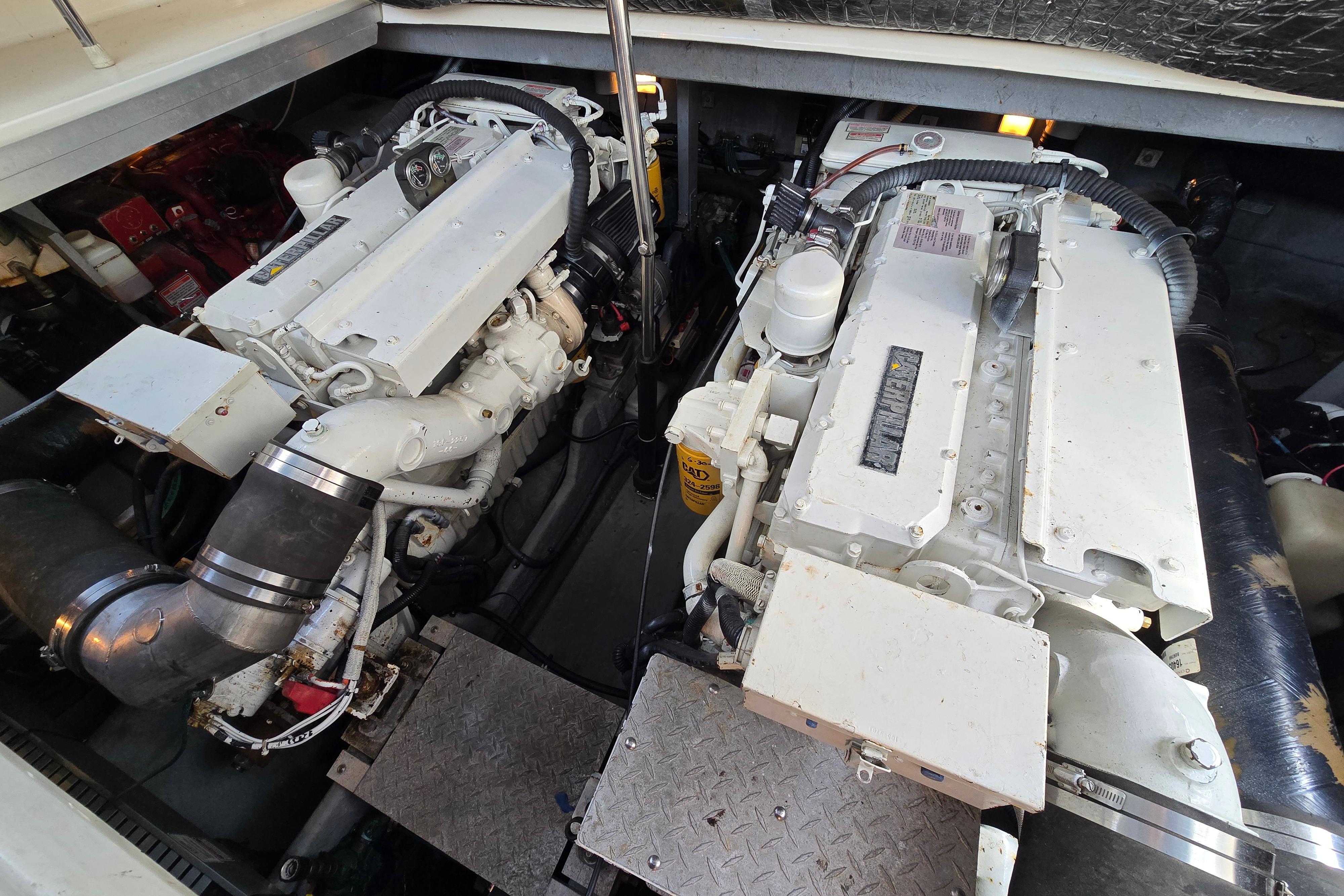 Engine room of a 1999 Sea Ray Sundancer 400, showcasing dual marine engines.