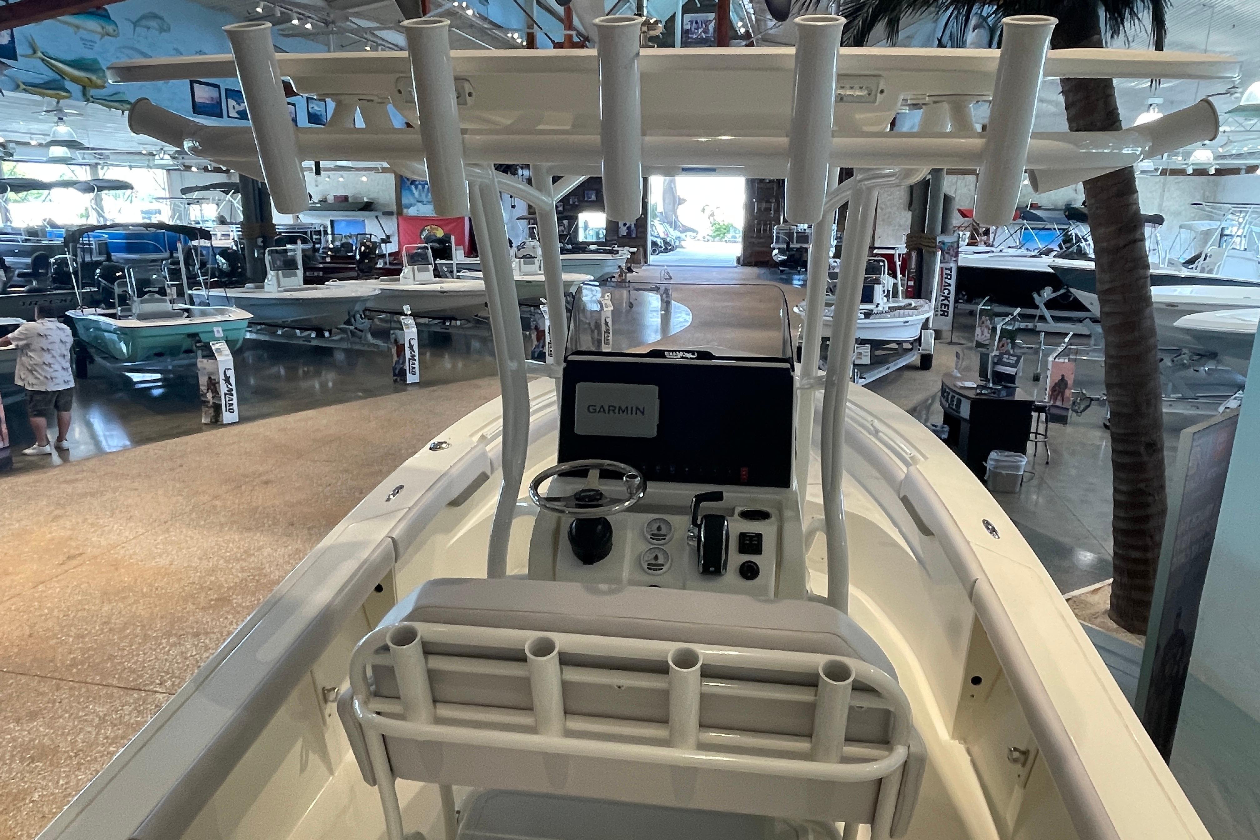 2026 Mako 226 Center Console boat interior with Garmin navigation, displayed in a showroom.