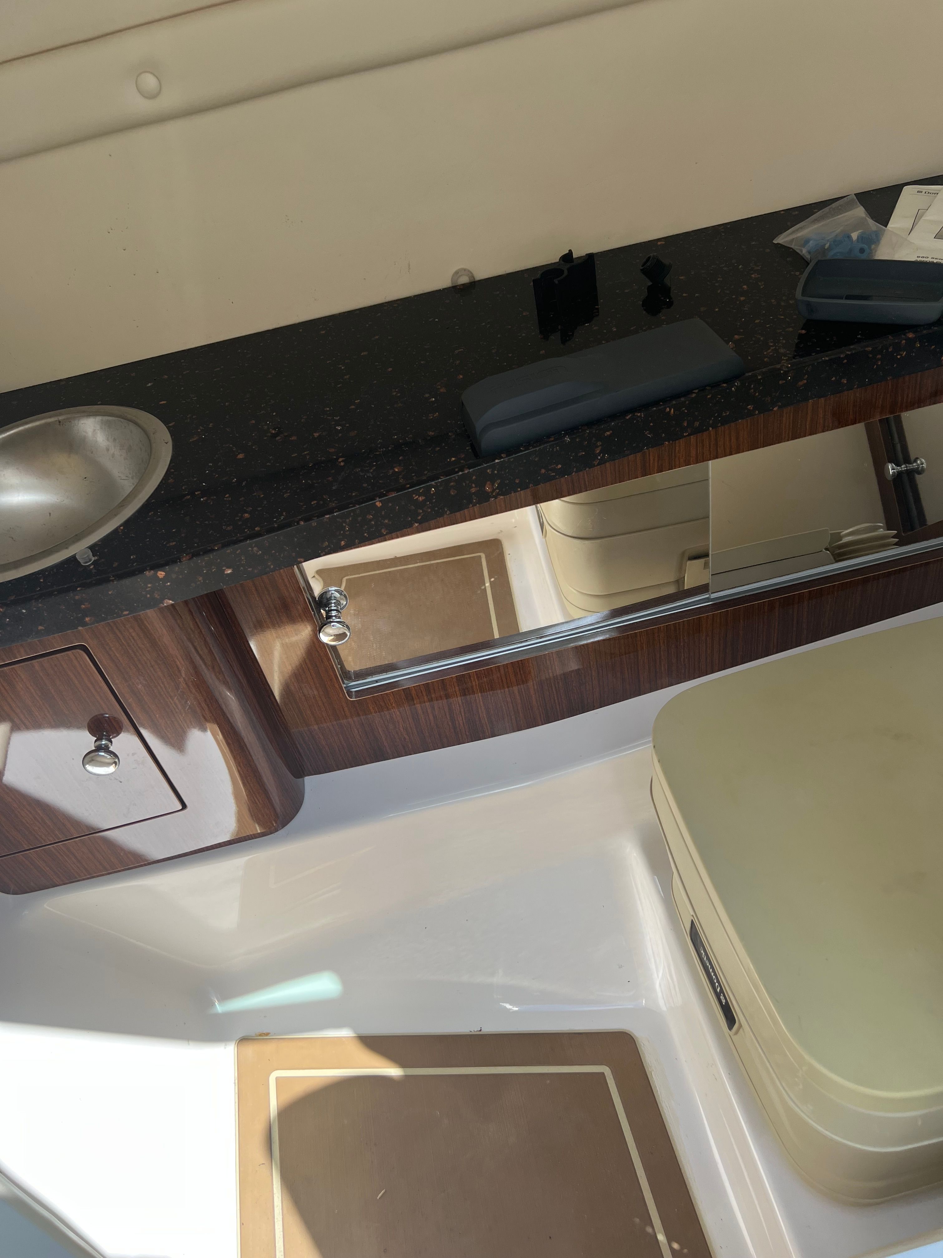 Interior of 2014 Regal 24 FasDeck RX with sink and storage.