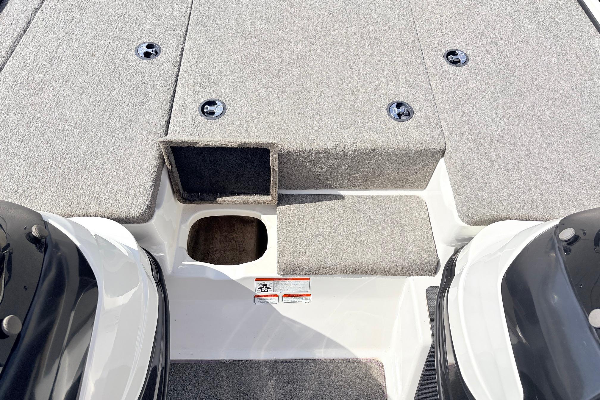 2011 Nitro Z-7 boat deck with carpeted surface and storage compartments.