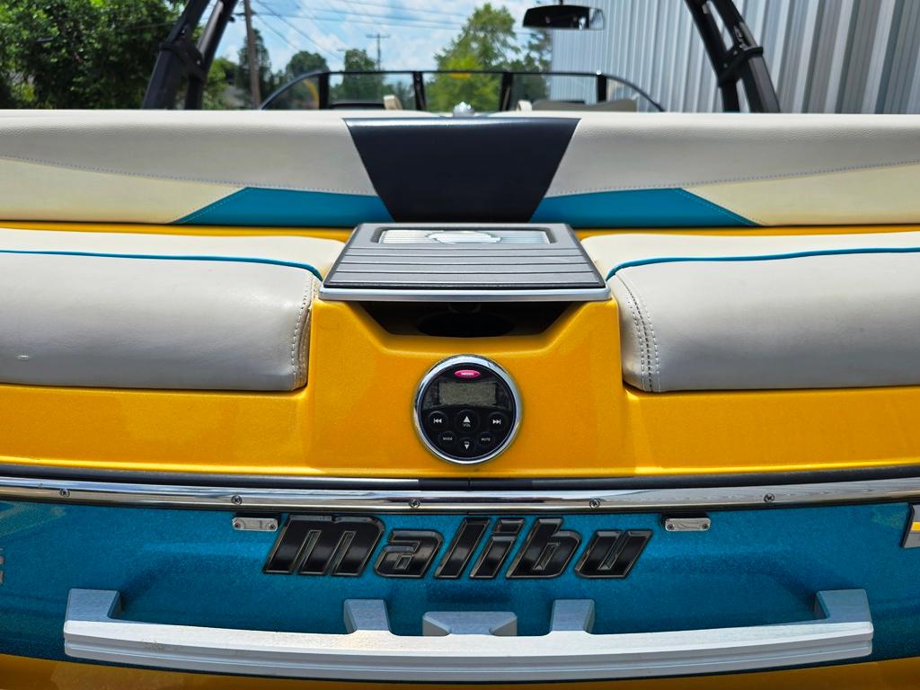 2015 Malibu Wakesetter 22 VLX Surf Gate, yellow and blue boat interior detail.