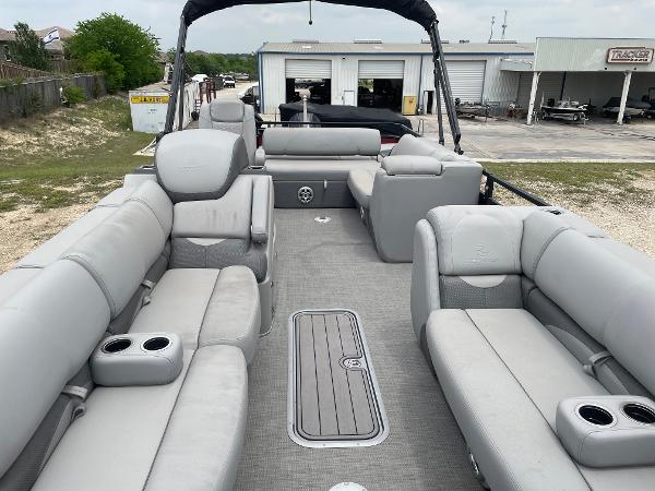 2023 Regency 250DL3 pontoon boat with spacious seating and modern design.
