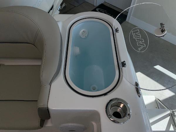 2024 Key West 263 FS boat interior with livewell and seating.