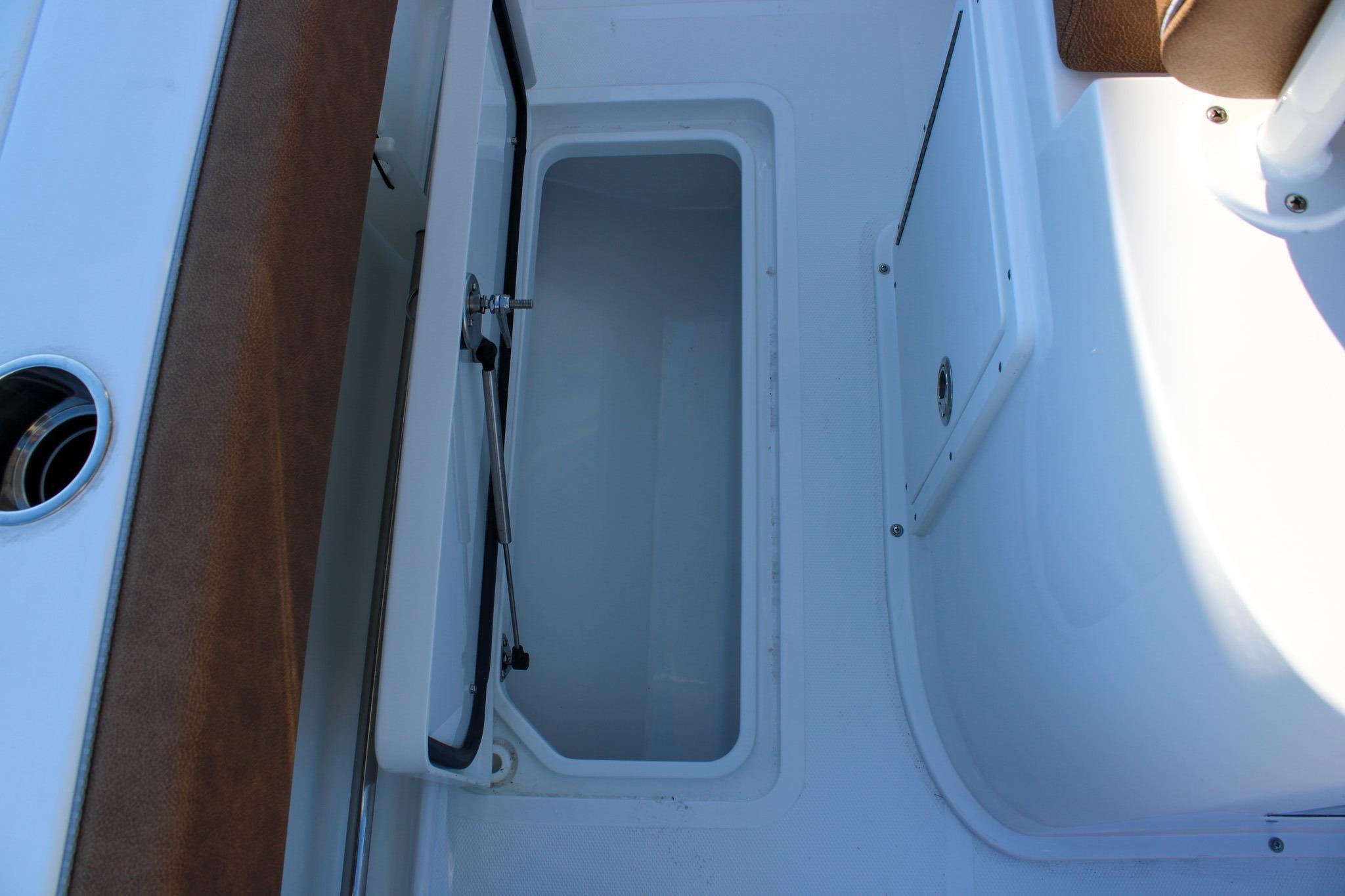 Open storage compartment on 2026 Sea Hunt Gamefish 25 boat.