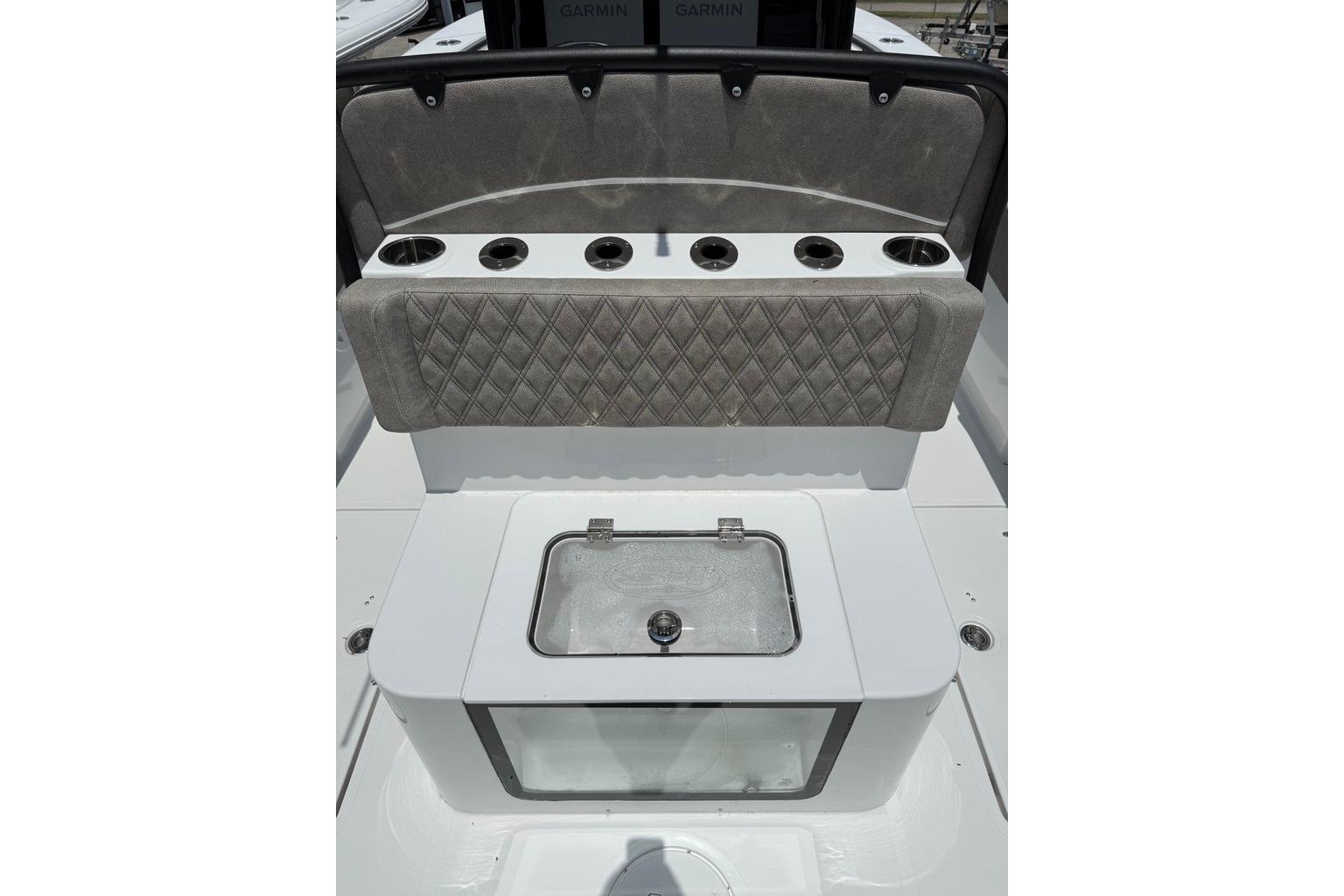 2026 Sea Hunt Gamefish 27 Coffin Box interior with cushioned seating and cup holders.