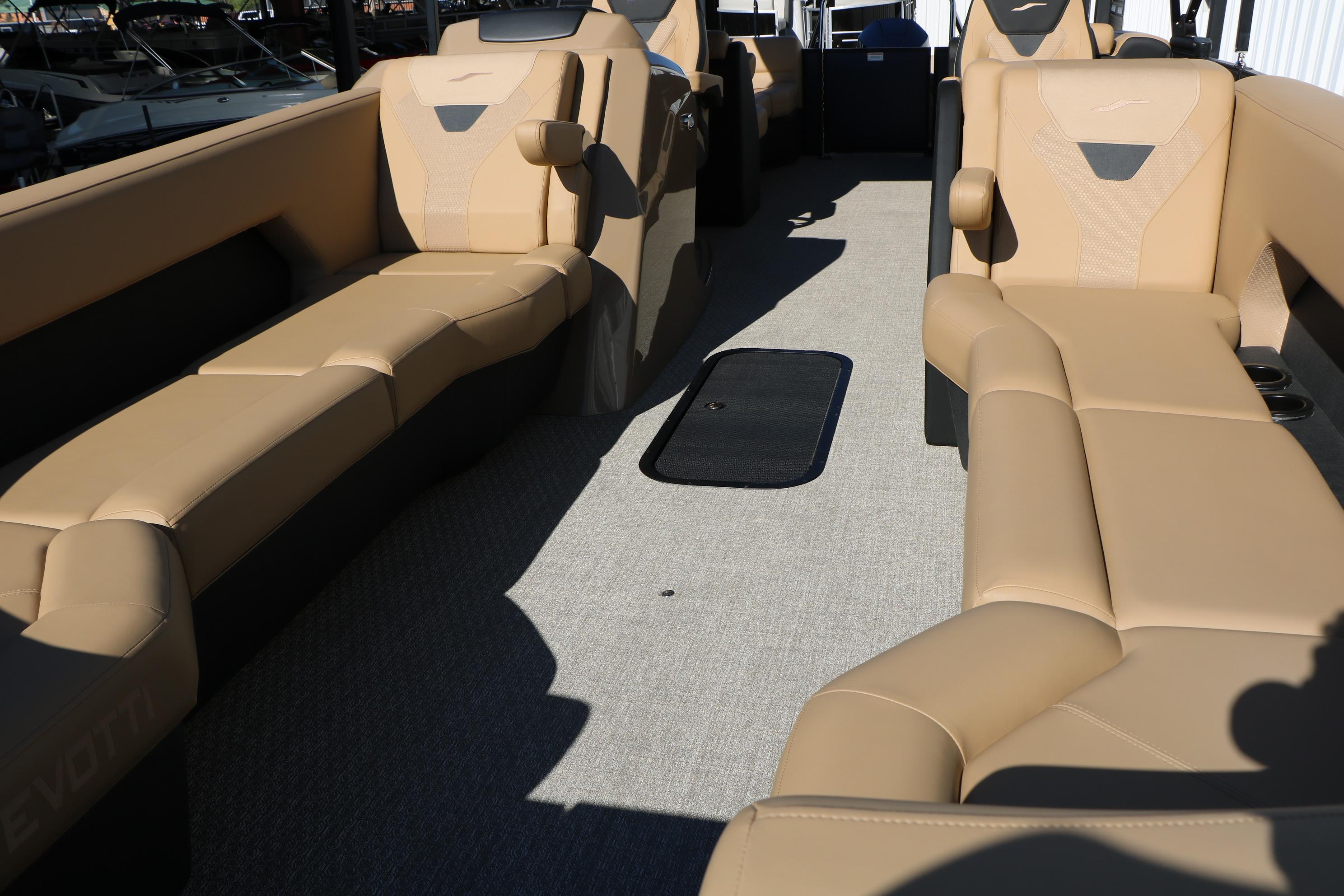 Luxurious interior of 2026 Evotti 525 QL Tri-Toon with beige seating and modern design.