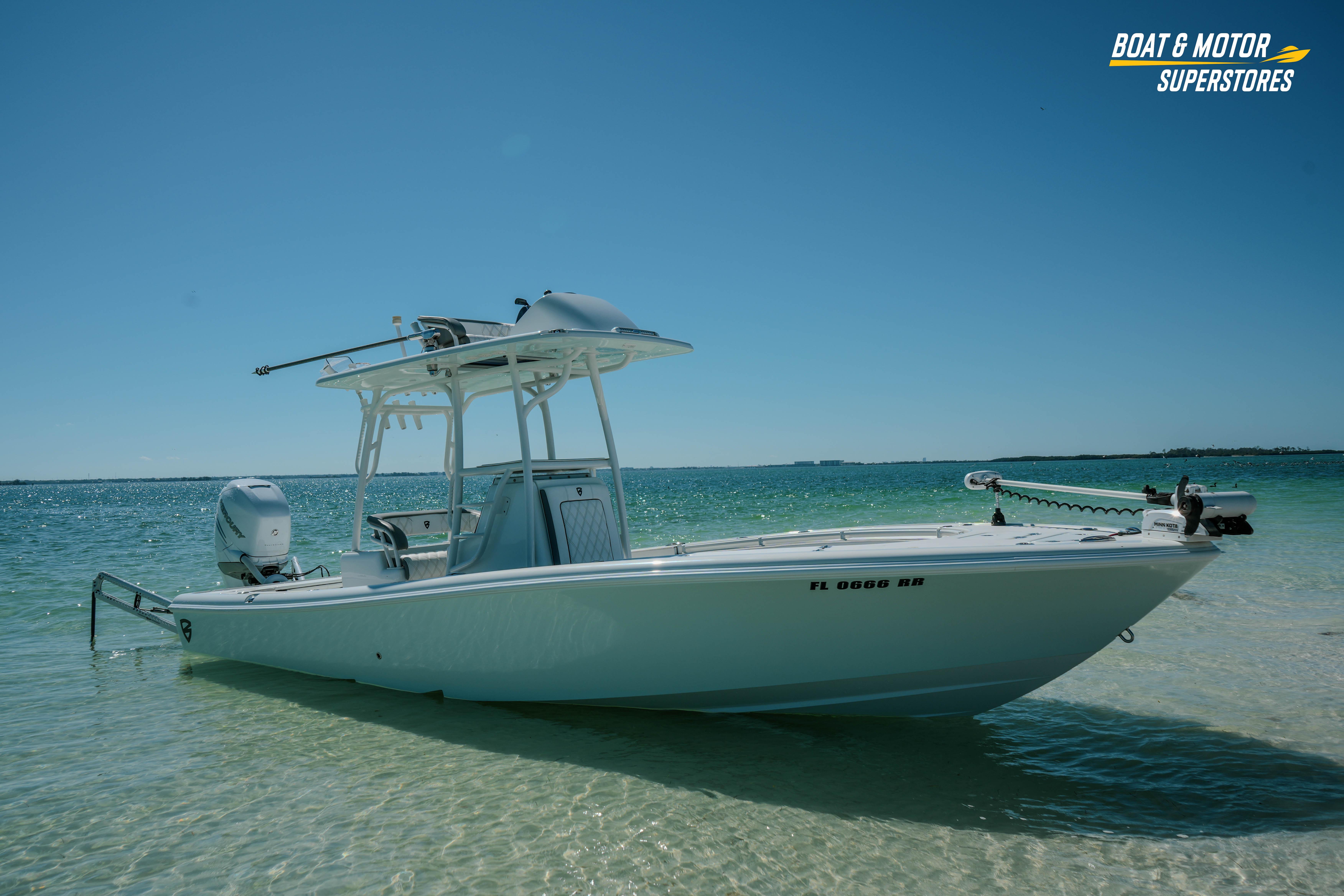2018 Barker Boatworks 26 Open in shallow water, clear sky, and calm sea.