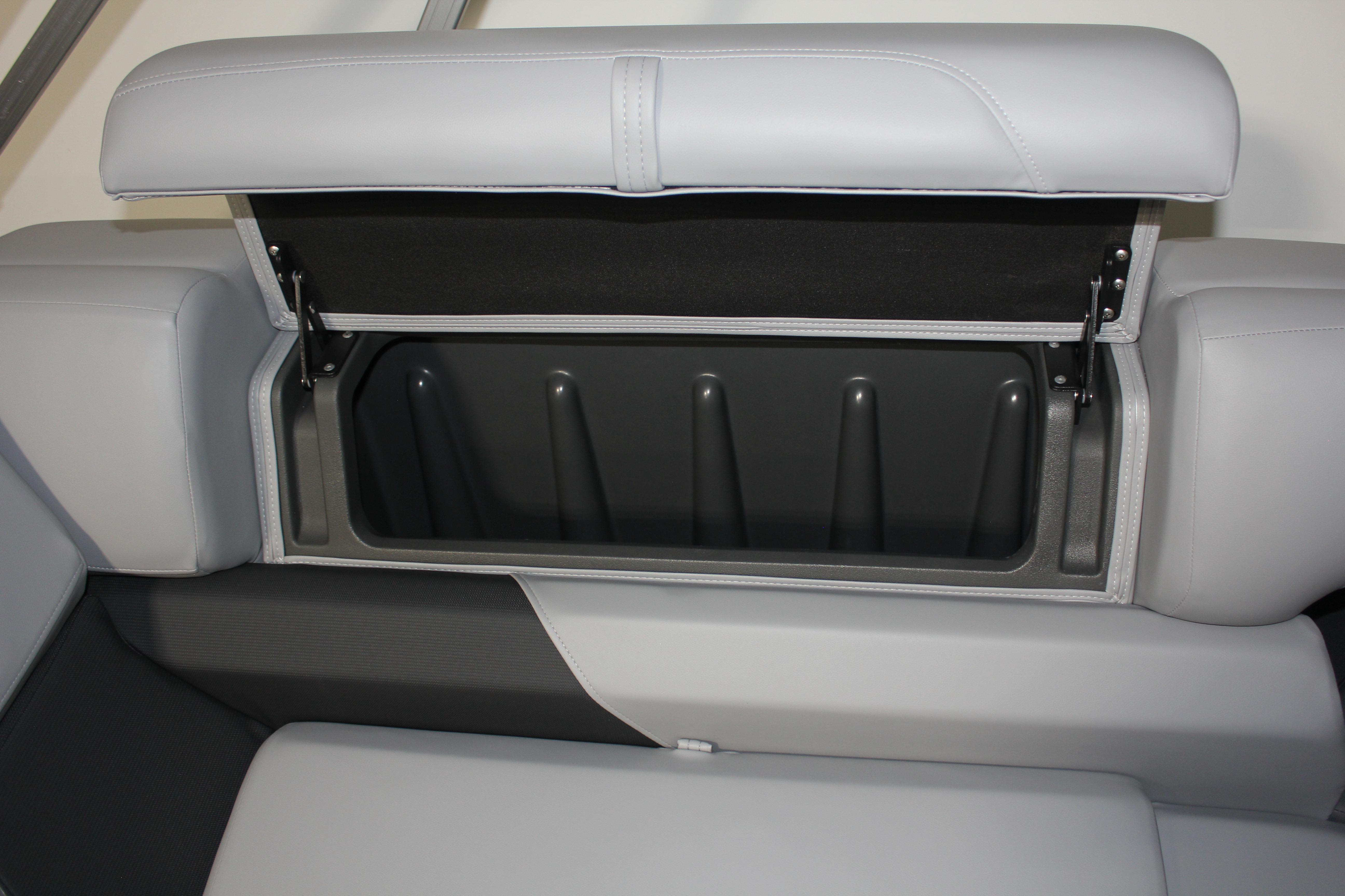 2026 Sun Tracker Party Barge 22 DLX storage compartment with open cushioned seat.