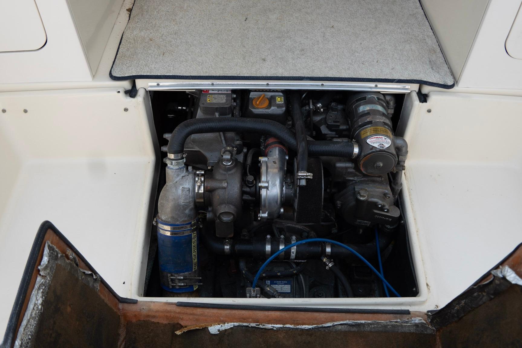 Engine compartment of a 2006 Atlas Boat Works Acadia 25, showcasing mechanical components.