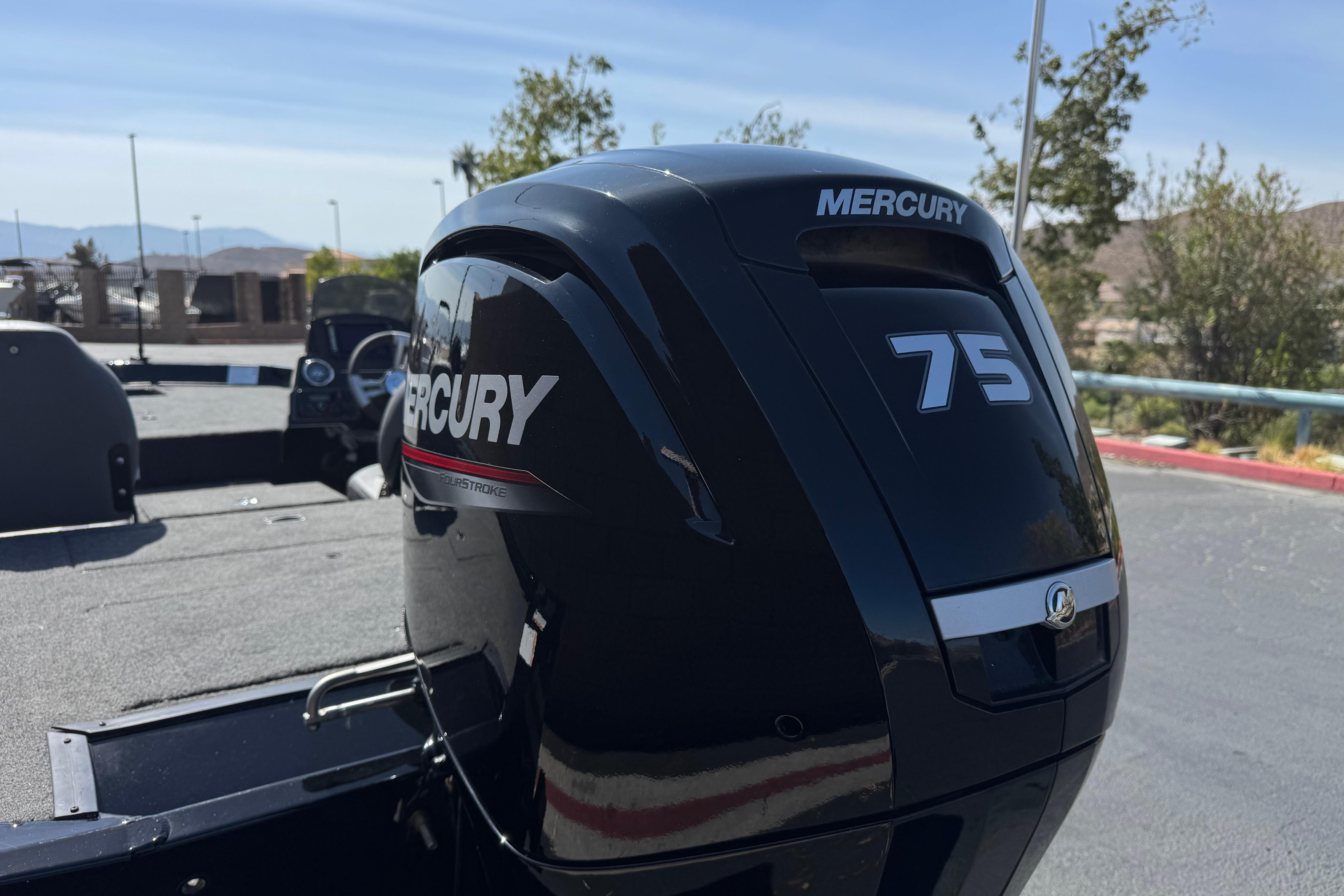 2024 Lowe Stinger 175 boat with Mercury 75 outboard motor in a sunny outdoor setting.