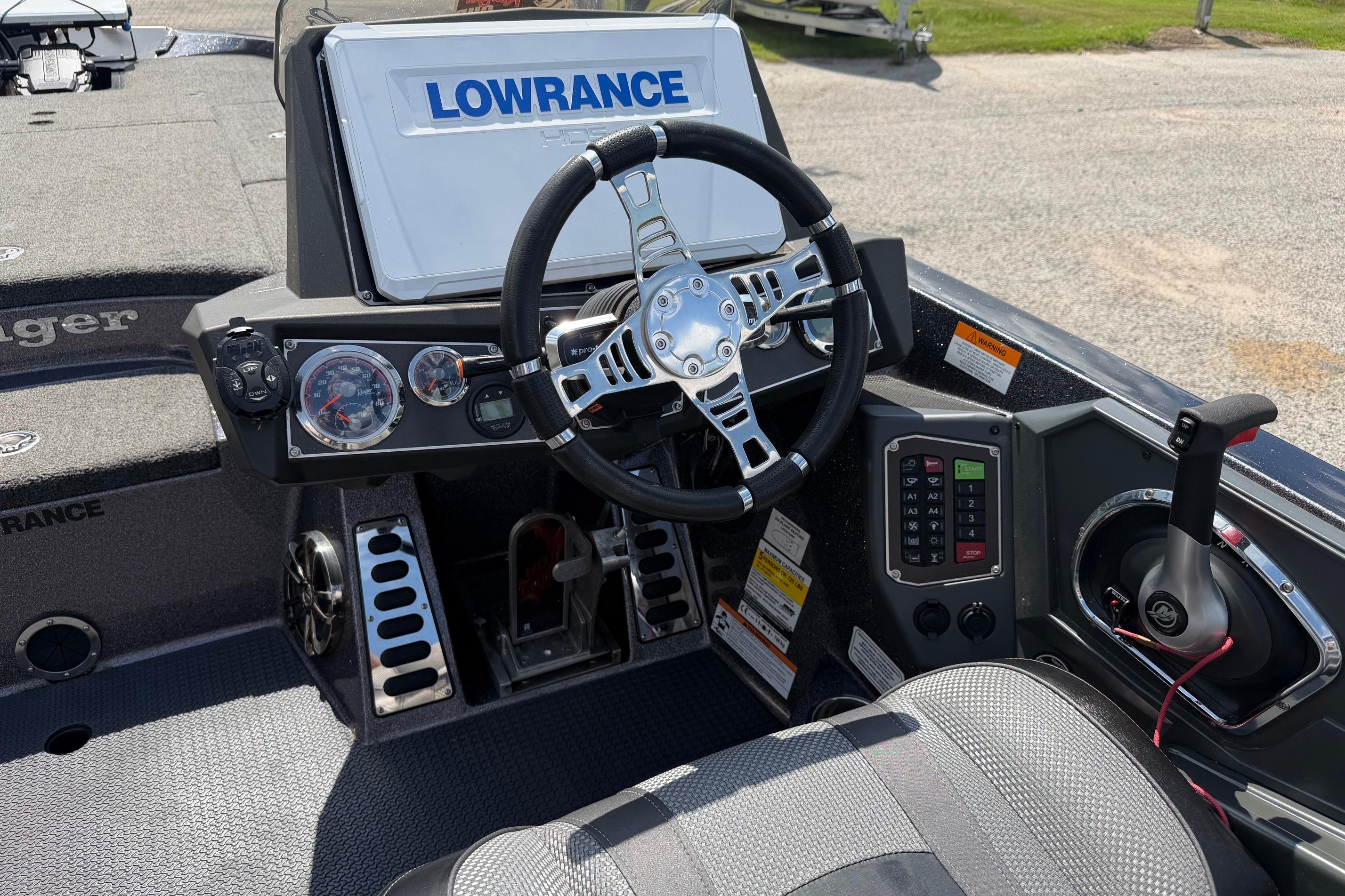 2020 Ranger Z520L boat cockpit with steering wheel, Lowrance display, and control panel.