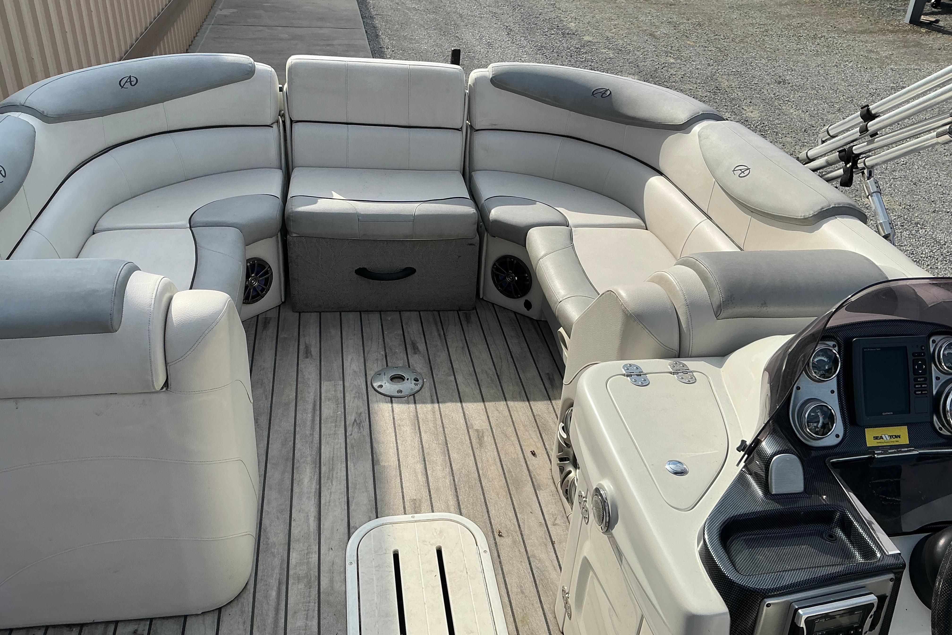 2014 Avalon 25 ft. Paradise Elite pontoon boat with spacious seating and modern dashboard.