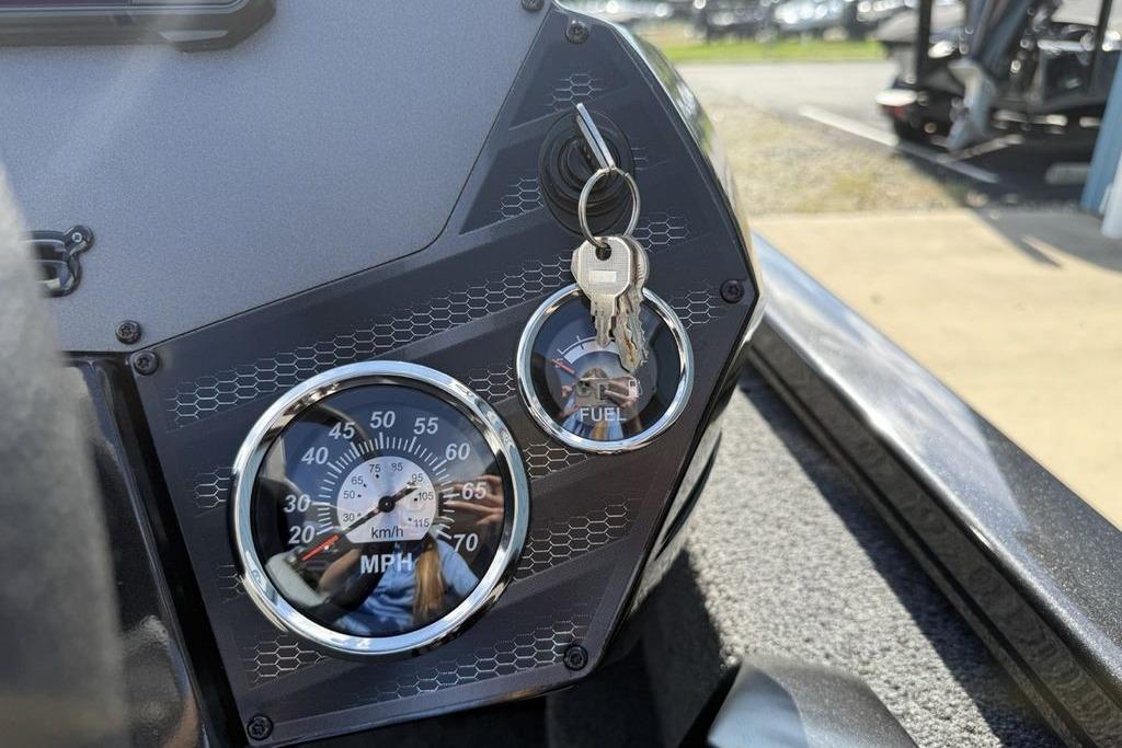 Dashboard of 2023 Vexus AVX189 boat with speedometer and ignition keys.