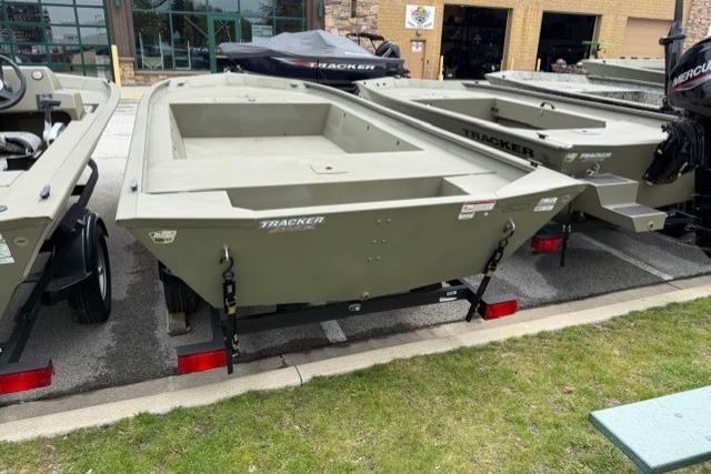 2026 Tracker Grizzly 2072 Utility boat displayed outdoors on a trailer.