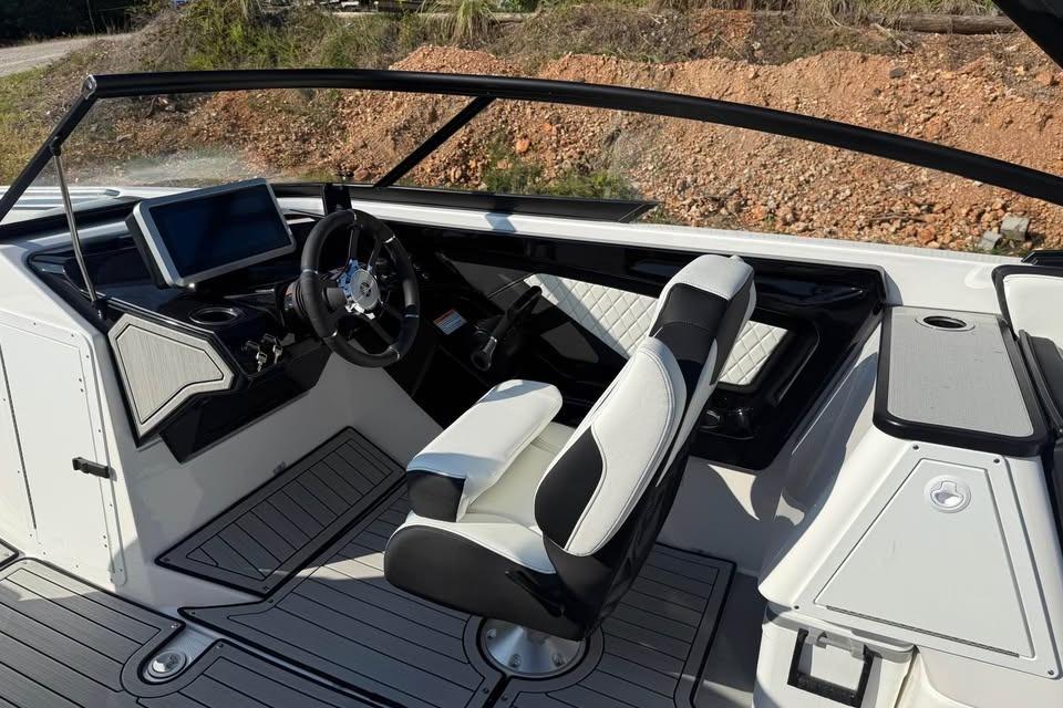 2026 Yamaha Boats 252S cockpit with modern steering and dashboard design.