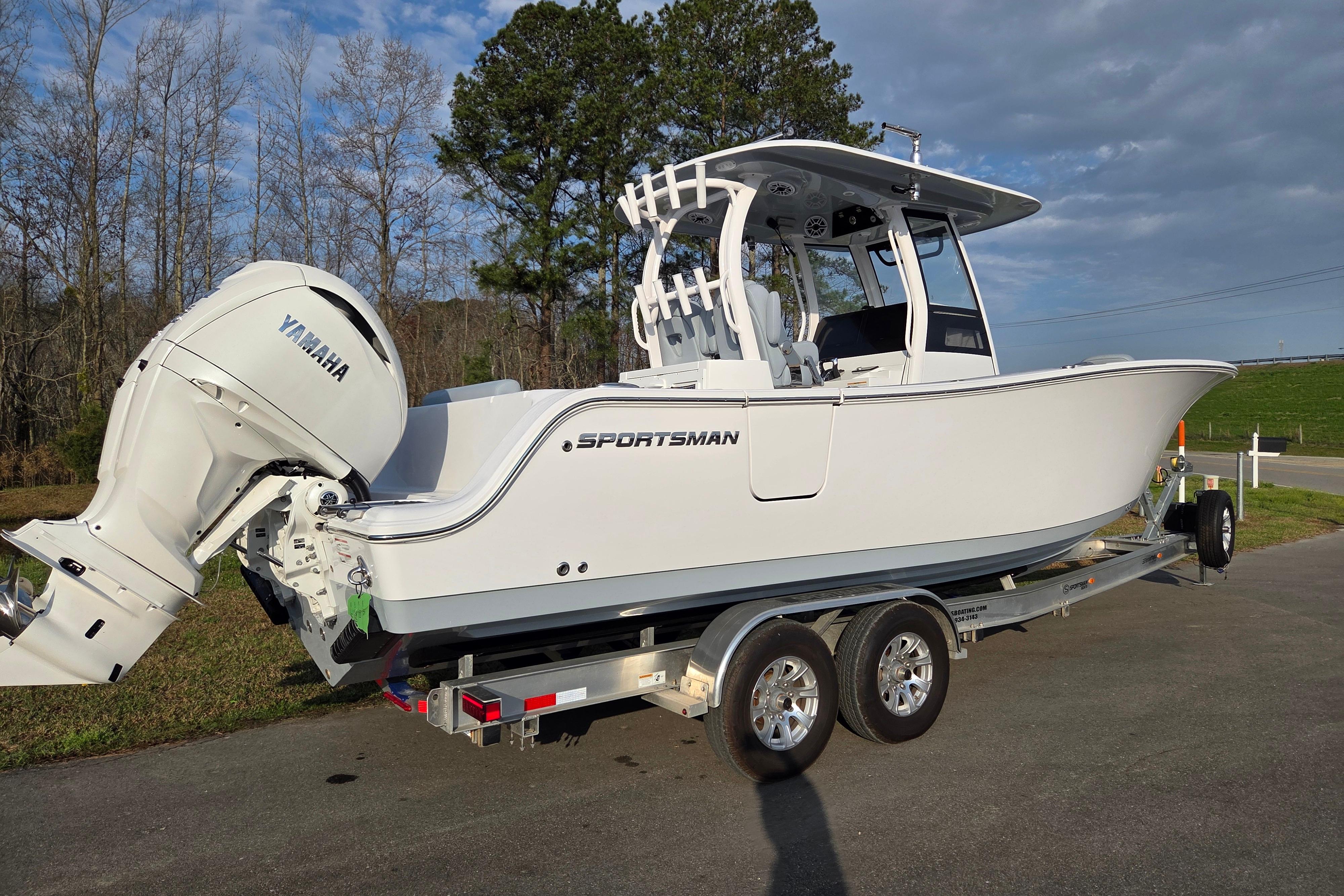 2026 Sportsman Open 282 Center Console boat on trailer with Yamaha engine.