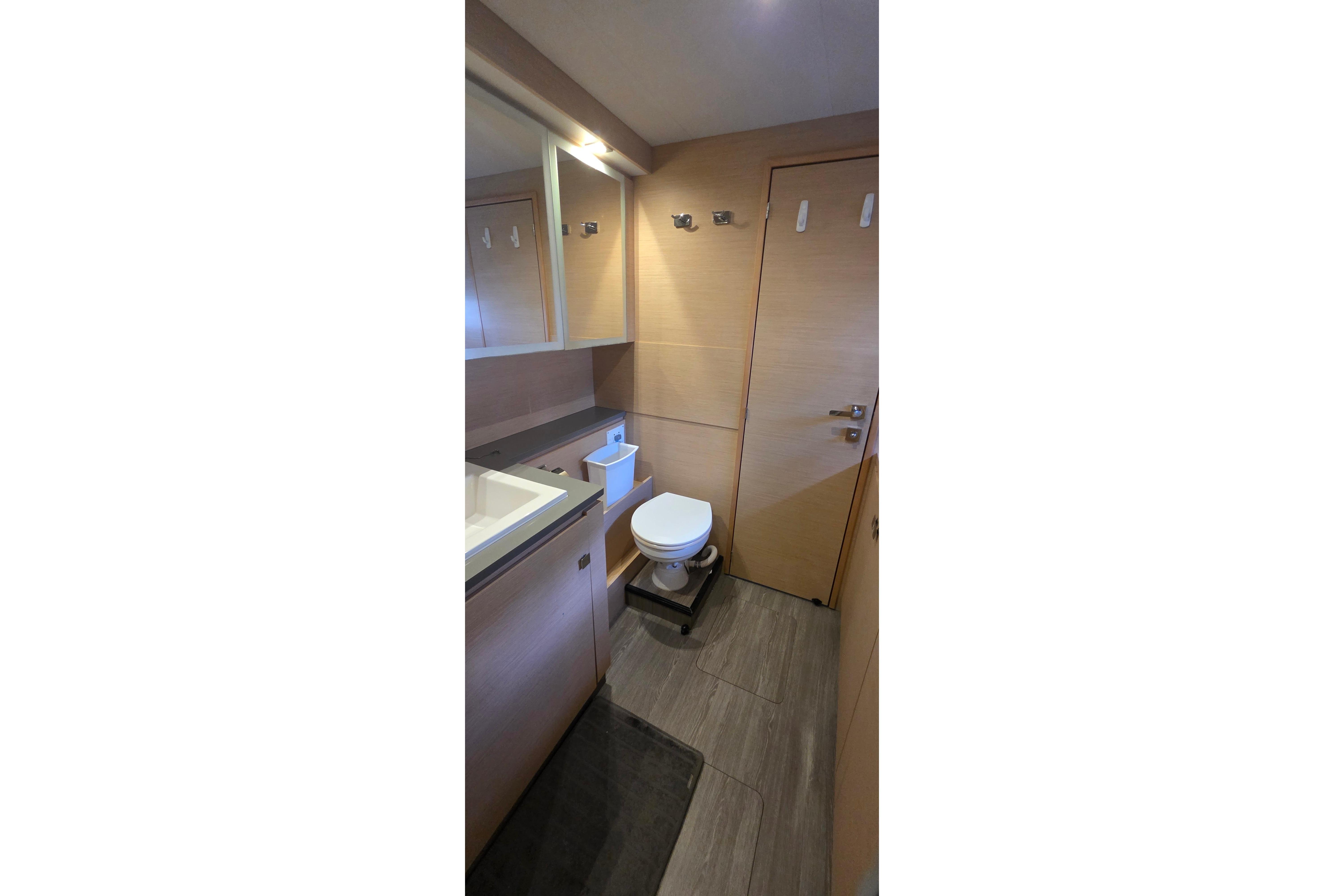 Modern bathroom interior on 2018 Fountaine Pajot Motor Yacht 44, featuring sleek design and amenities.