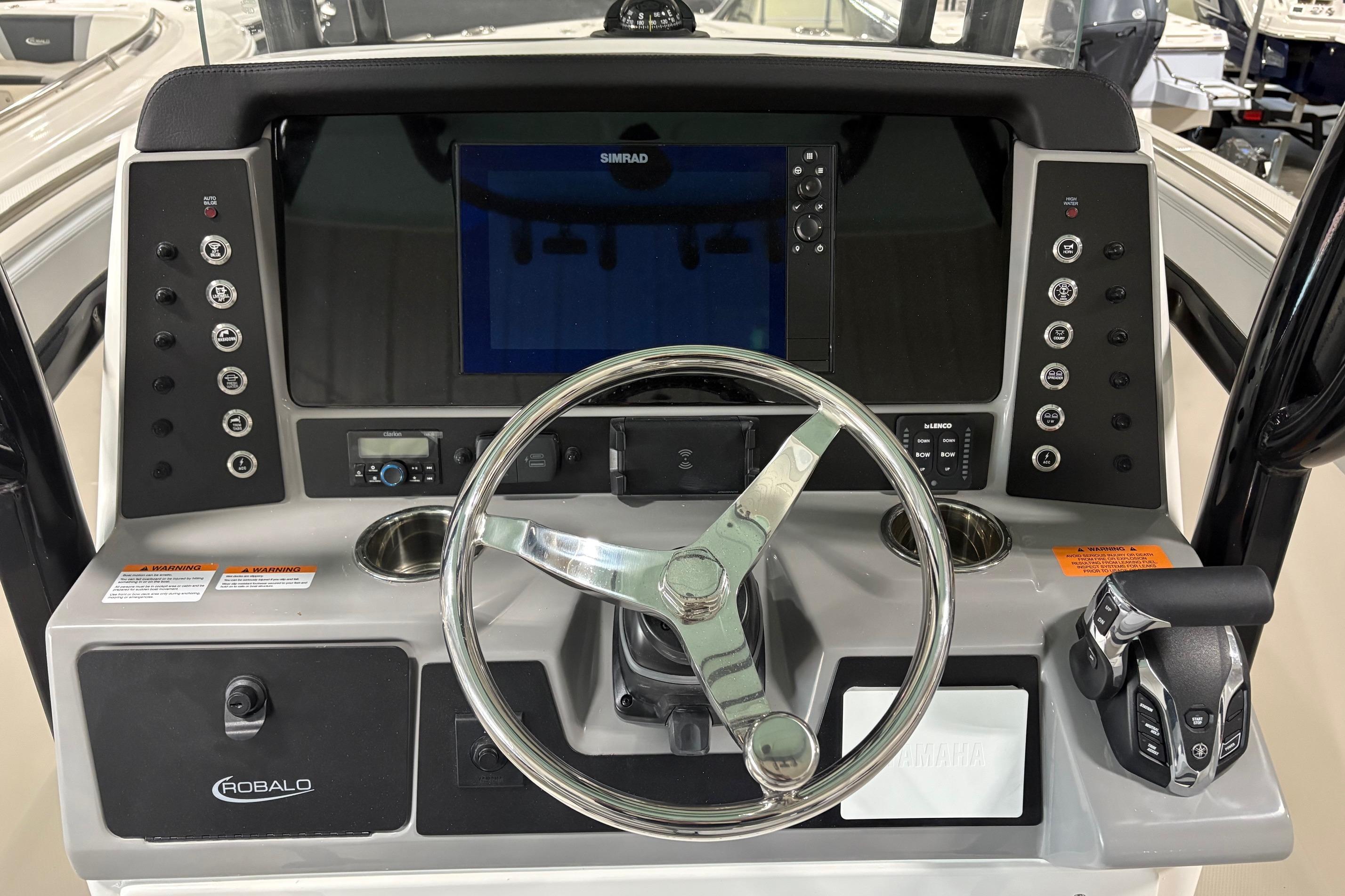 2025 Robalo R232 Explorer boat dashboard with steering wheel and control panel.