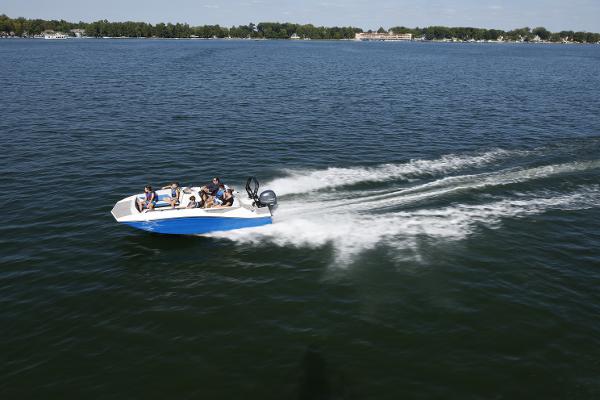 2025 Starcraft SV 16 OB boat cruising on a lake with passengers.