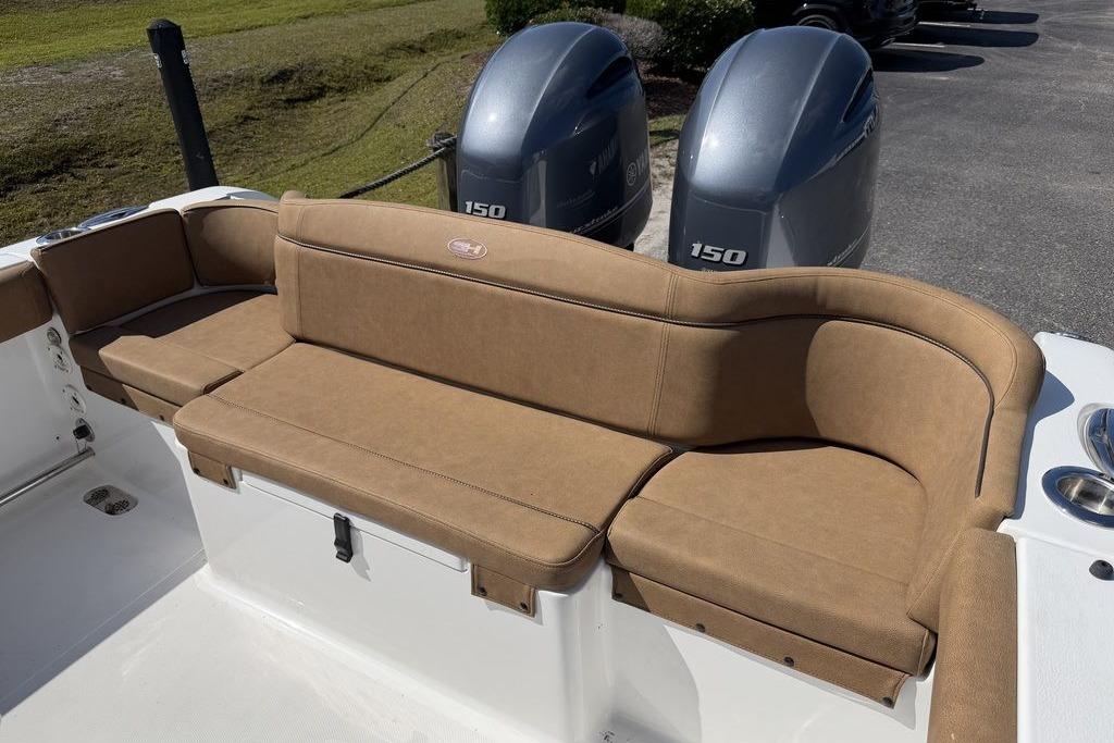 2024 Sea Hunt Ultra 265 SE boat with tan seating and dual 150 horsepower engines.