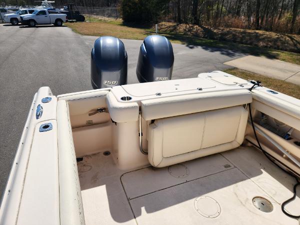 2015 Grady-White Freedom 275 boat with twin 250 engines, parked outdoors.