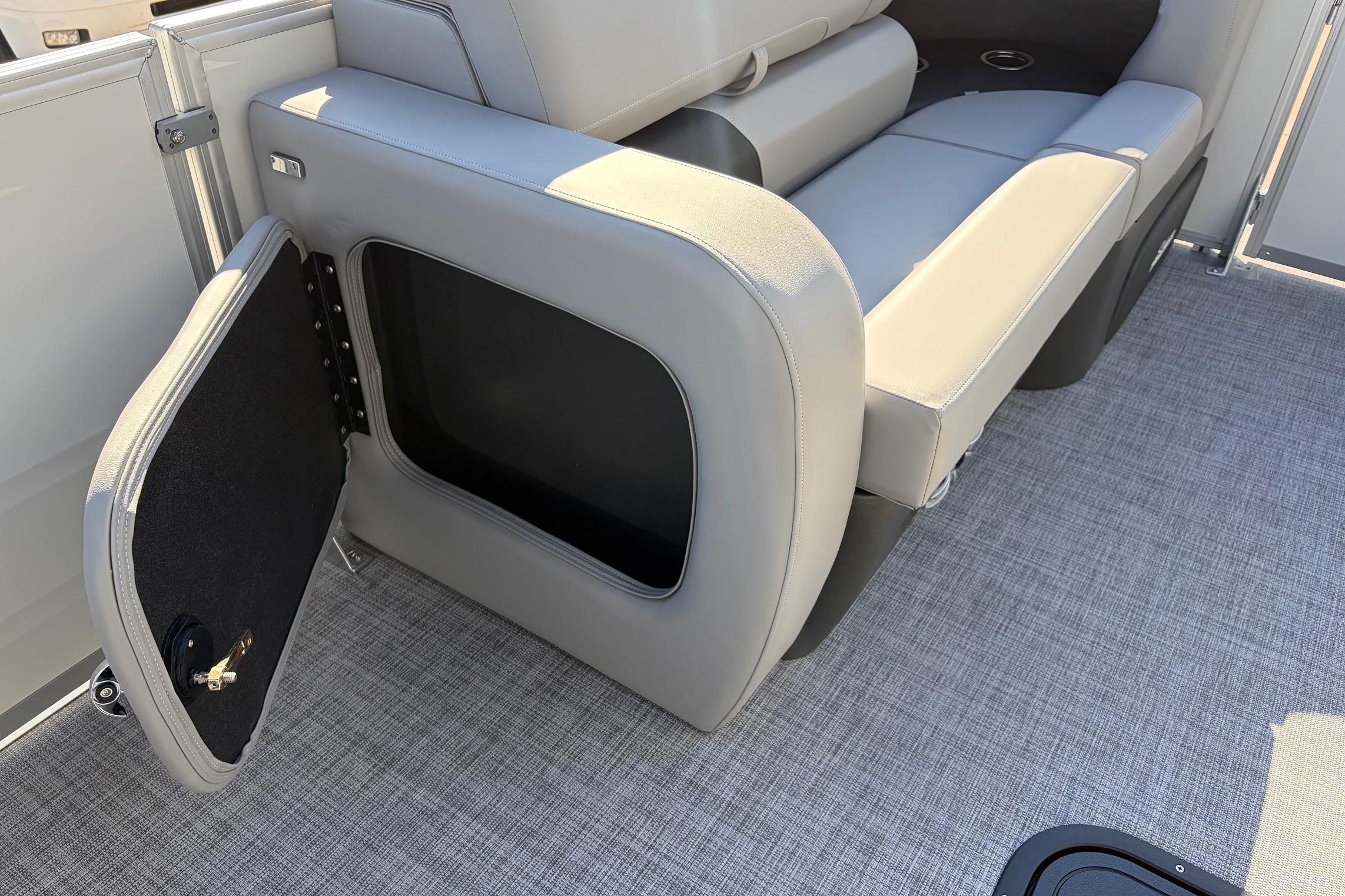 Sun Tracker Party Barge 22 RF XP3, 2026 model, featuring open storage compartment and seating.