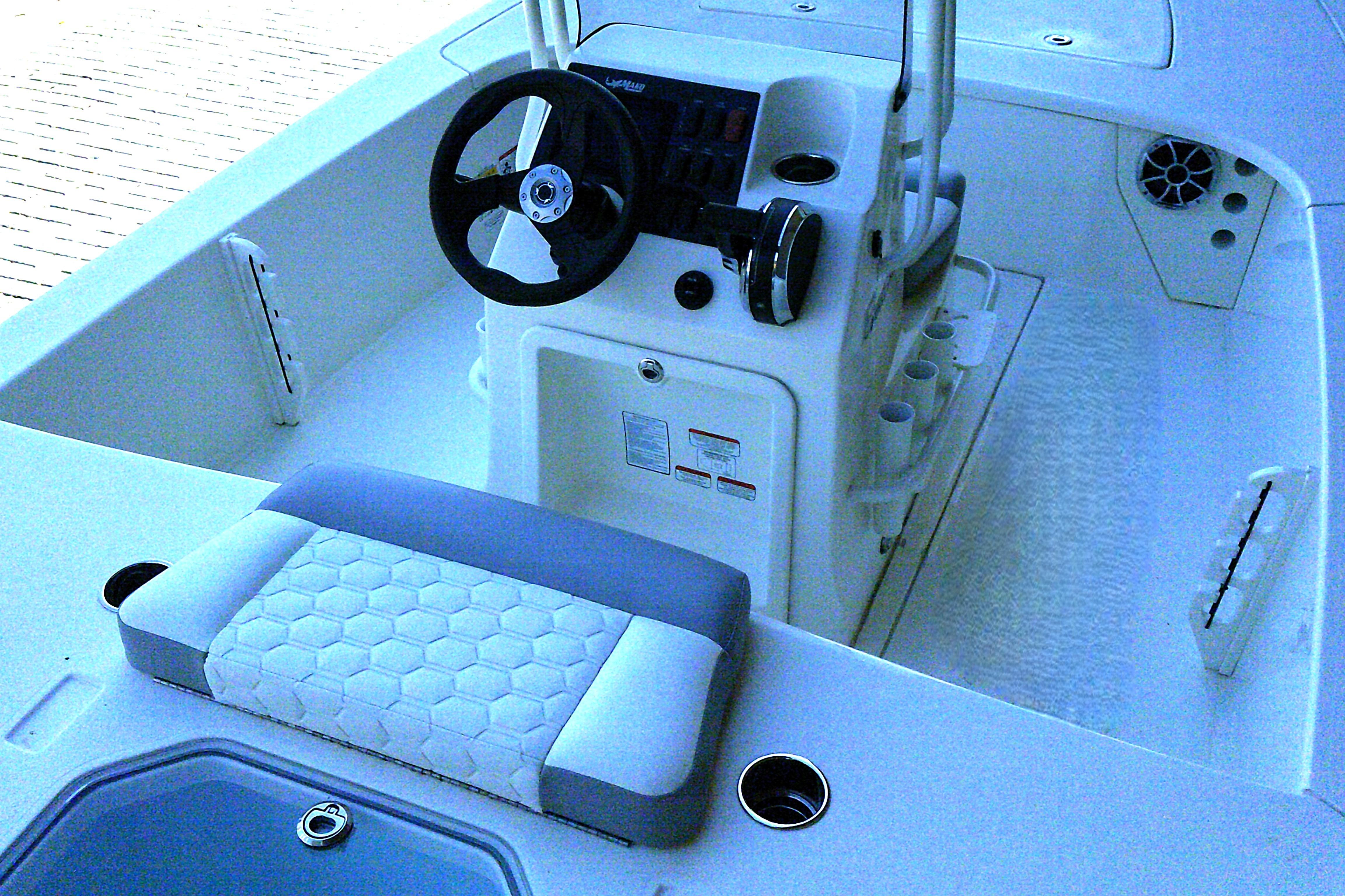 2026 Mako 18 Pro Skiff boat interior with steering console and seating.
